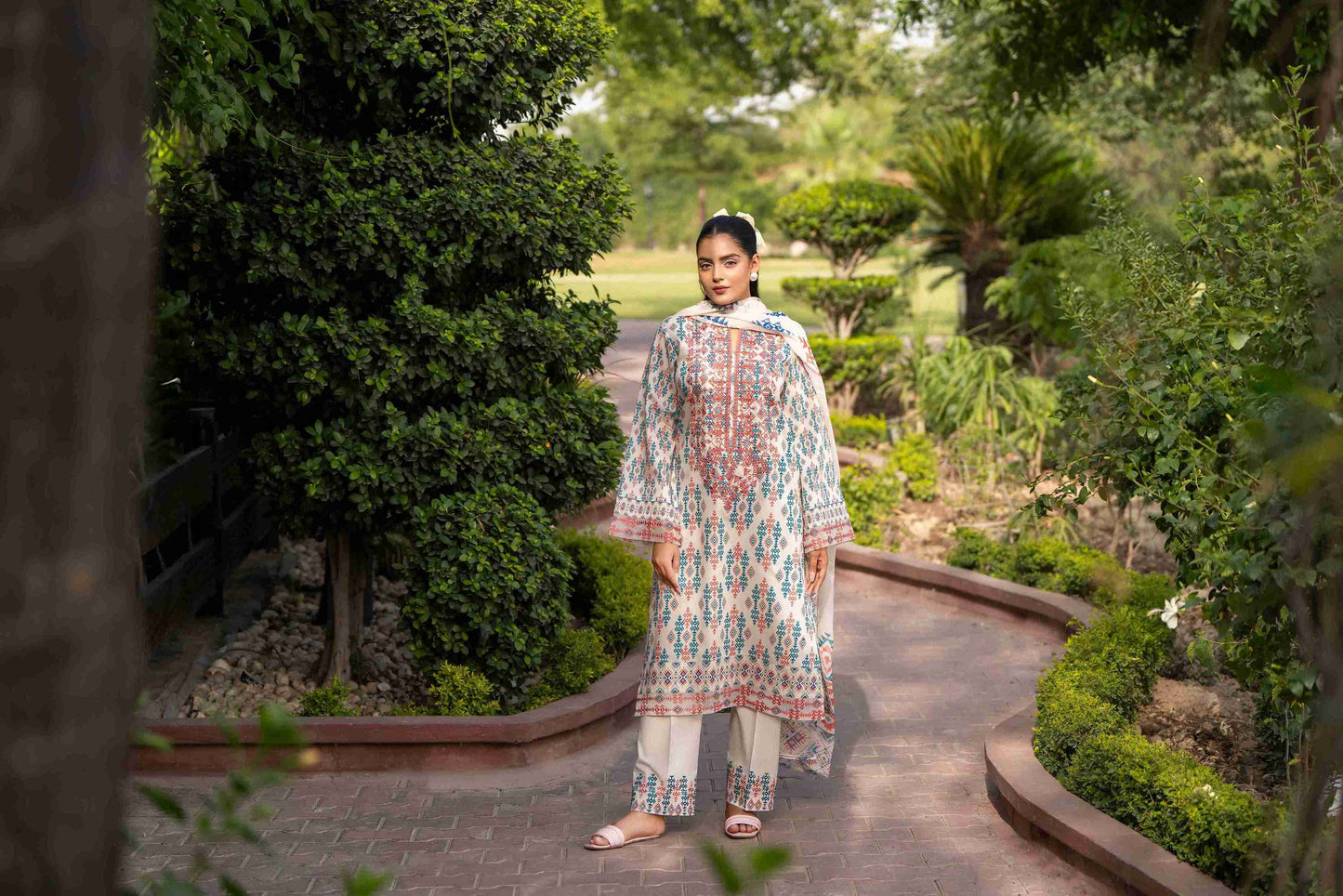 Richly colored kurta featuring embroidered neckline, airy chiffon dupatta, and breathable cotton trouser