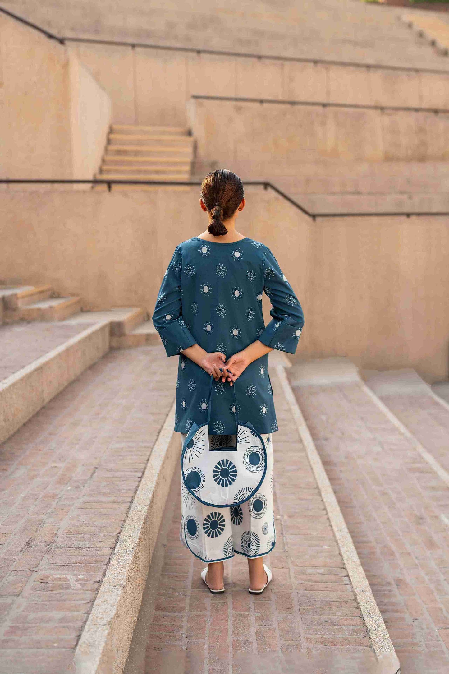 Stitched Jacquard kurta with bell sleeves and stylish neckline, paired with cotton trousers