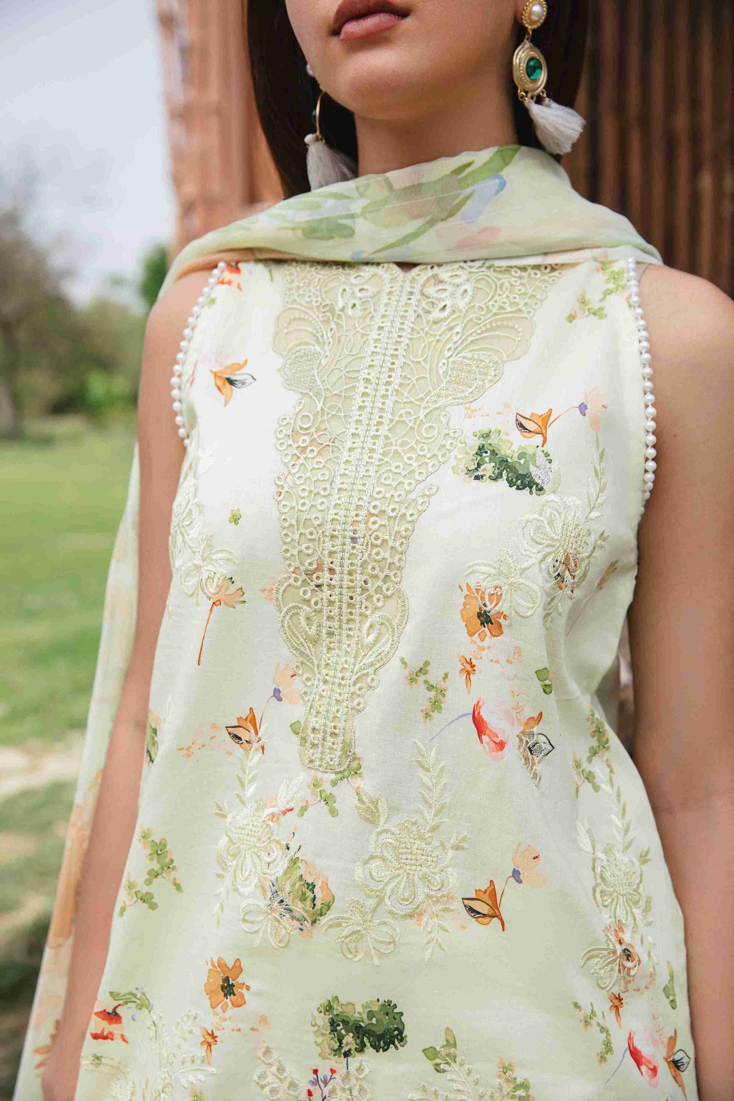 Lawn outfit with embroidery, chiffon dupatta, and plain cotton trouser.