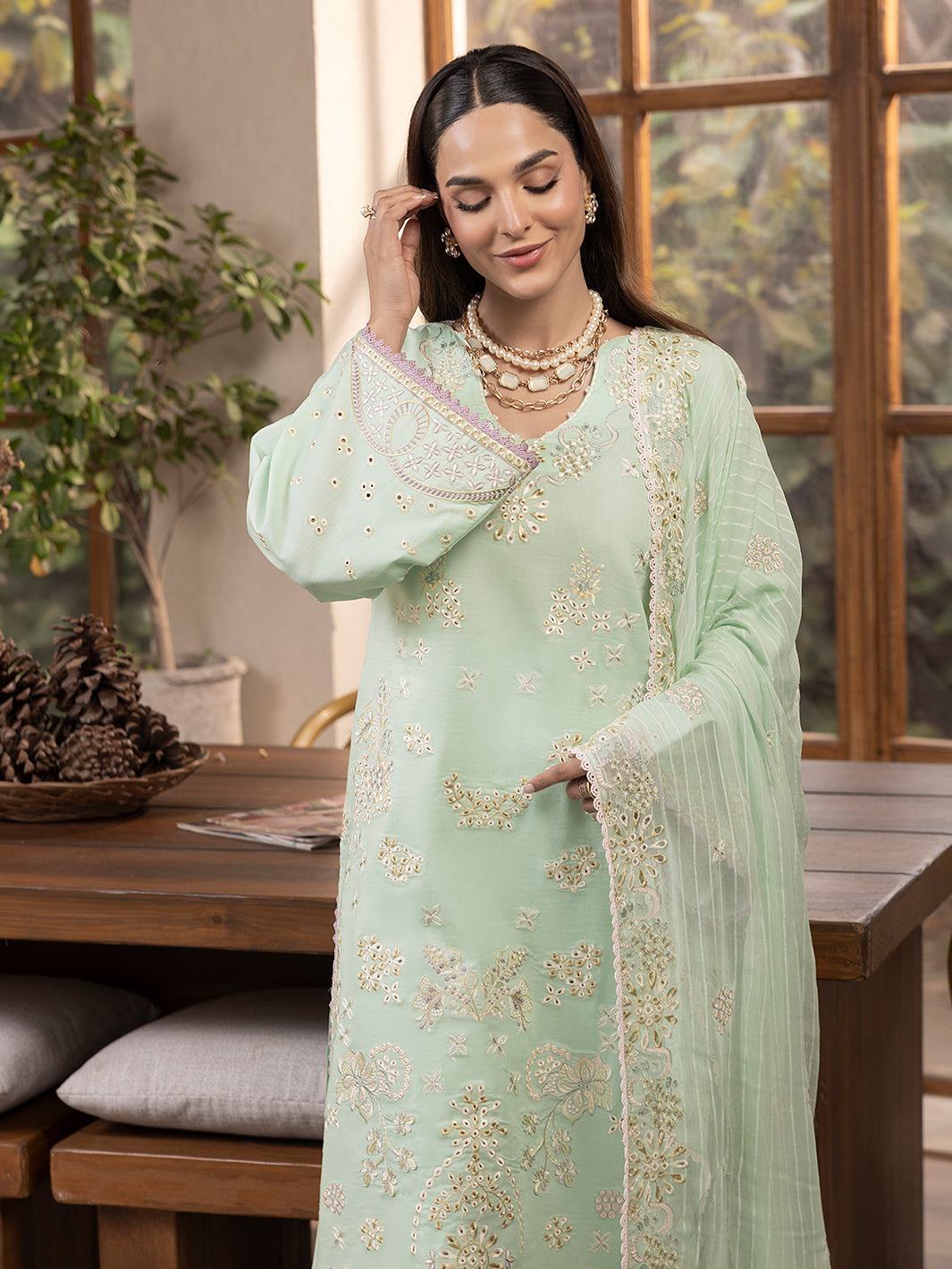 Premium printed lawn suit styled with embroidered patches for chic summer style