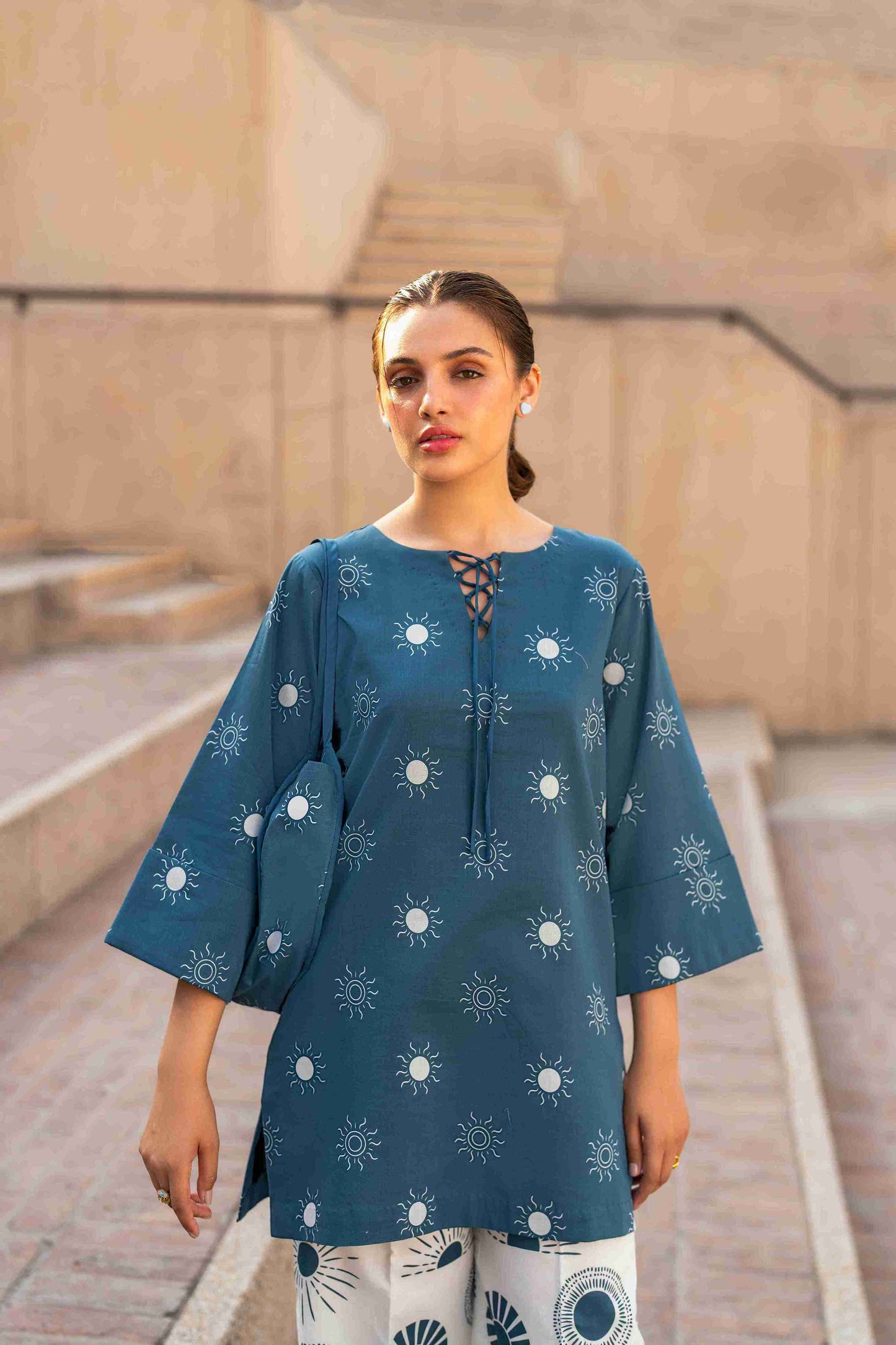 Premium Jacquard stitched tunic styled with bell bottom cotton trousers for eastern wear