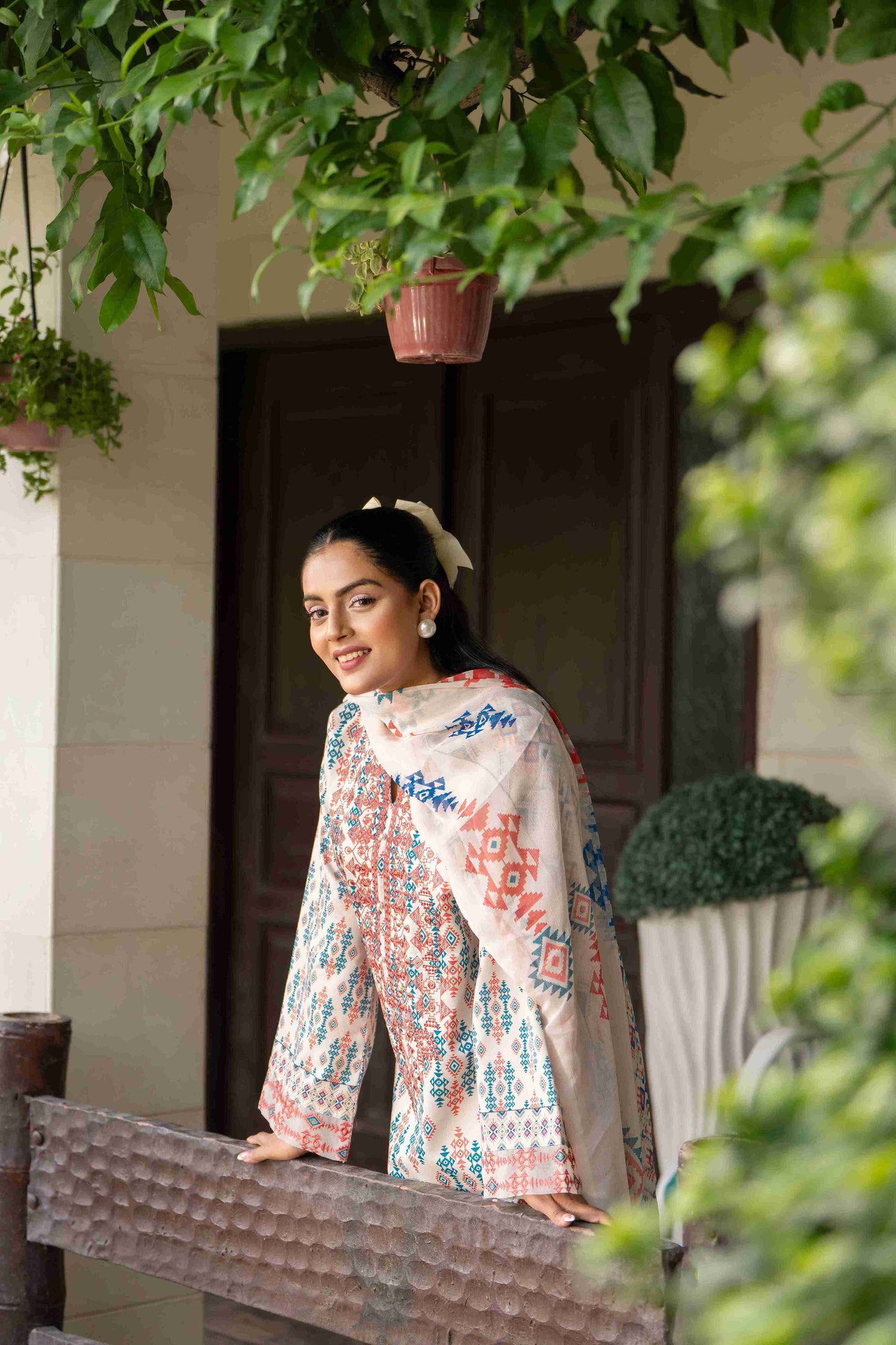 Elegant eastern outfit crafted from branded lawn, featuring embroidered neckline and chiffon dupatta with cotton trousers.