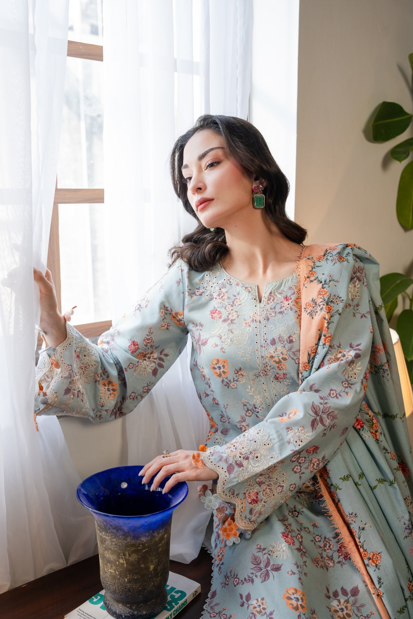 Khaddar winter outfit featuring printed shirt, embroidered organza neckline, and dyed pants.
