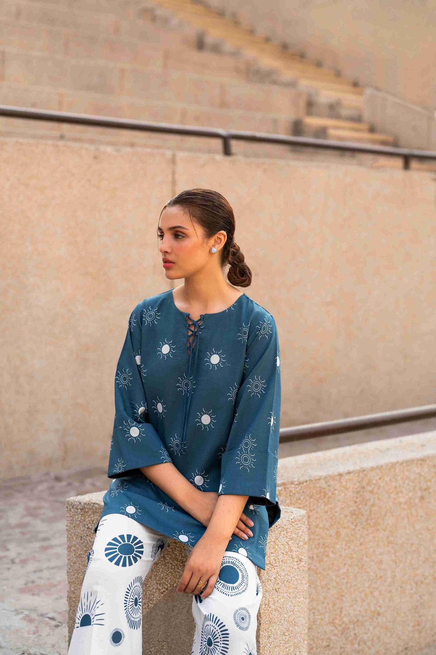 Jacquard stitched kurta with crisscross neckline and bell sleeves for summer gatherings