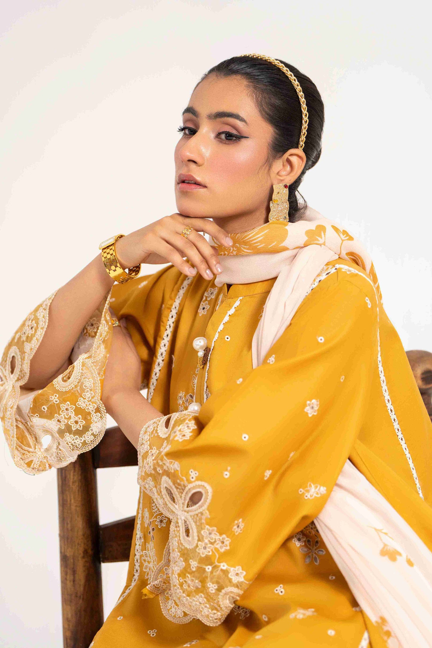 Stylish embroidered lawn shirt matched with chiffon printed dupatta and cotton trouser.