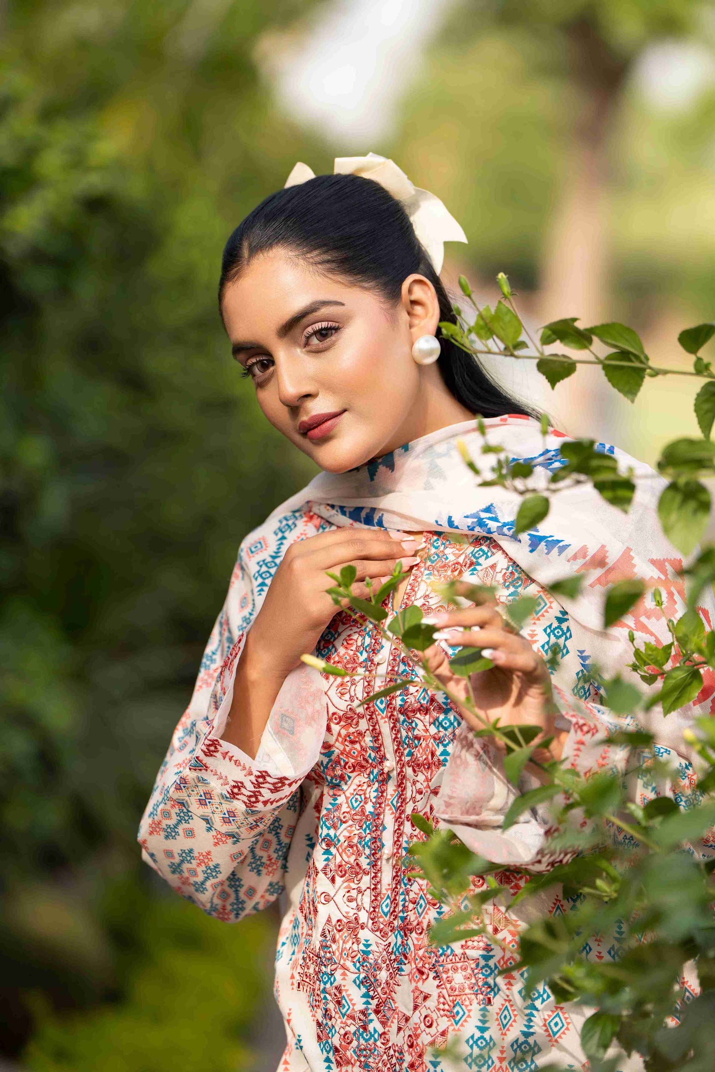 A versatile summer lawn kurta paired with embroidered neckline, chiffon dupatta, and cotton trouser for modern vibes