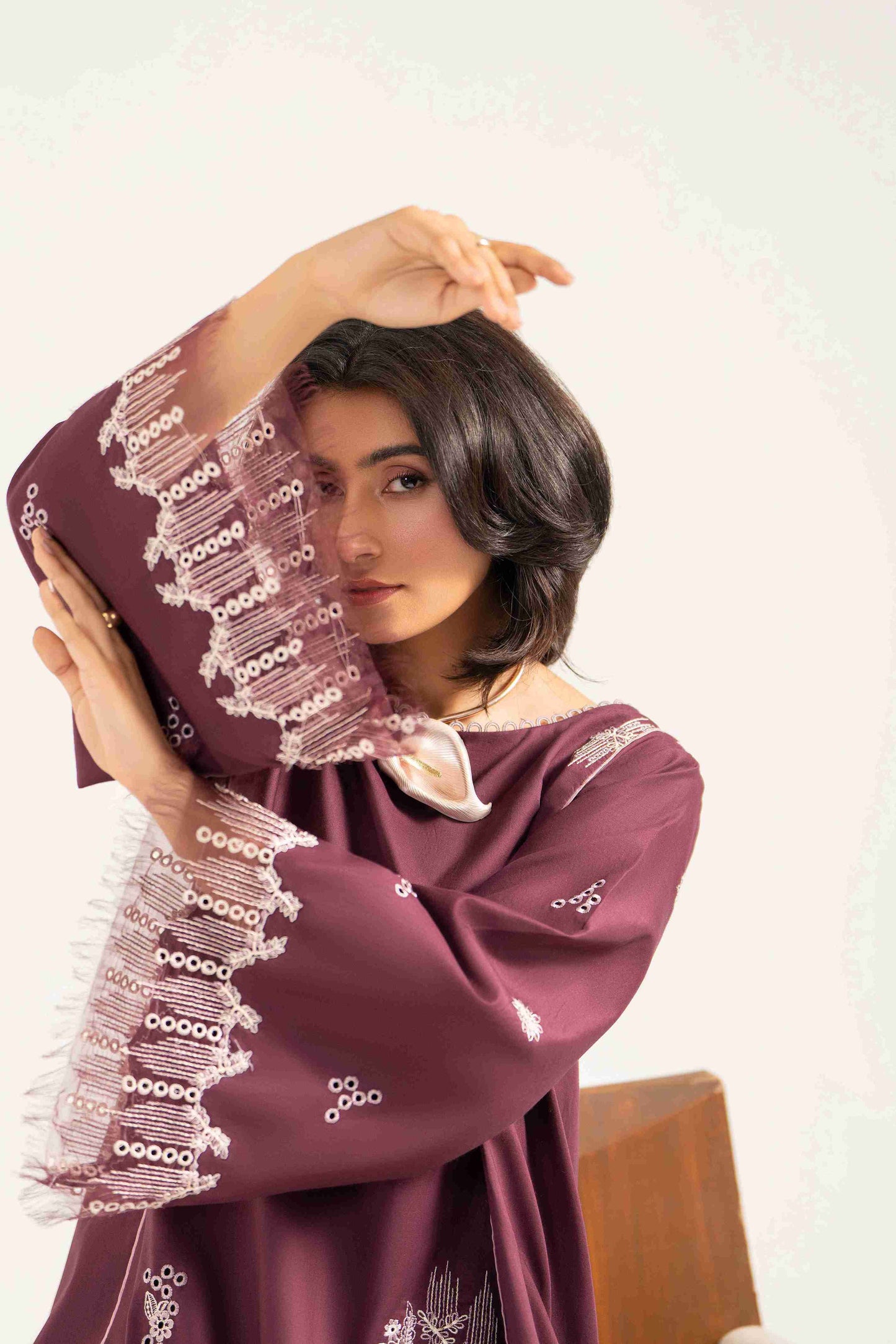 Unstitched embroidered lawn shirt styled with chiffon dupatta and soft cotton trouser.