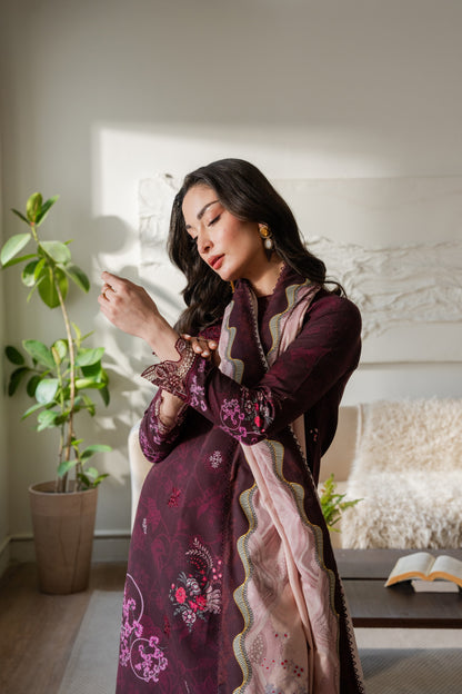 Embroidered khaddar winter suit with elegant organza details and colorful dupatta.