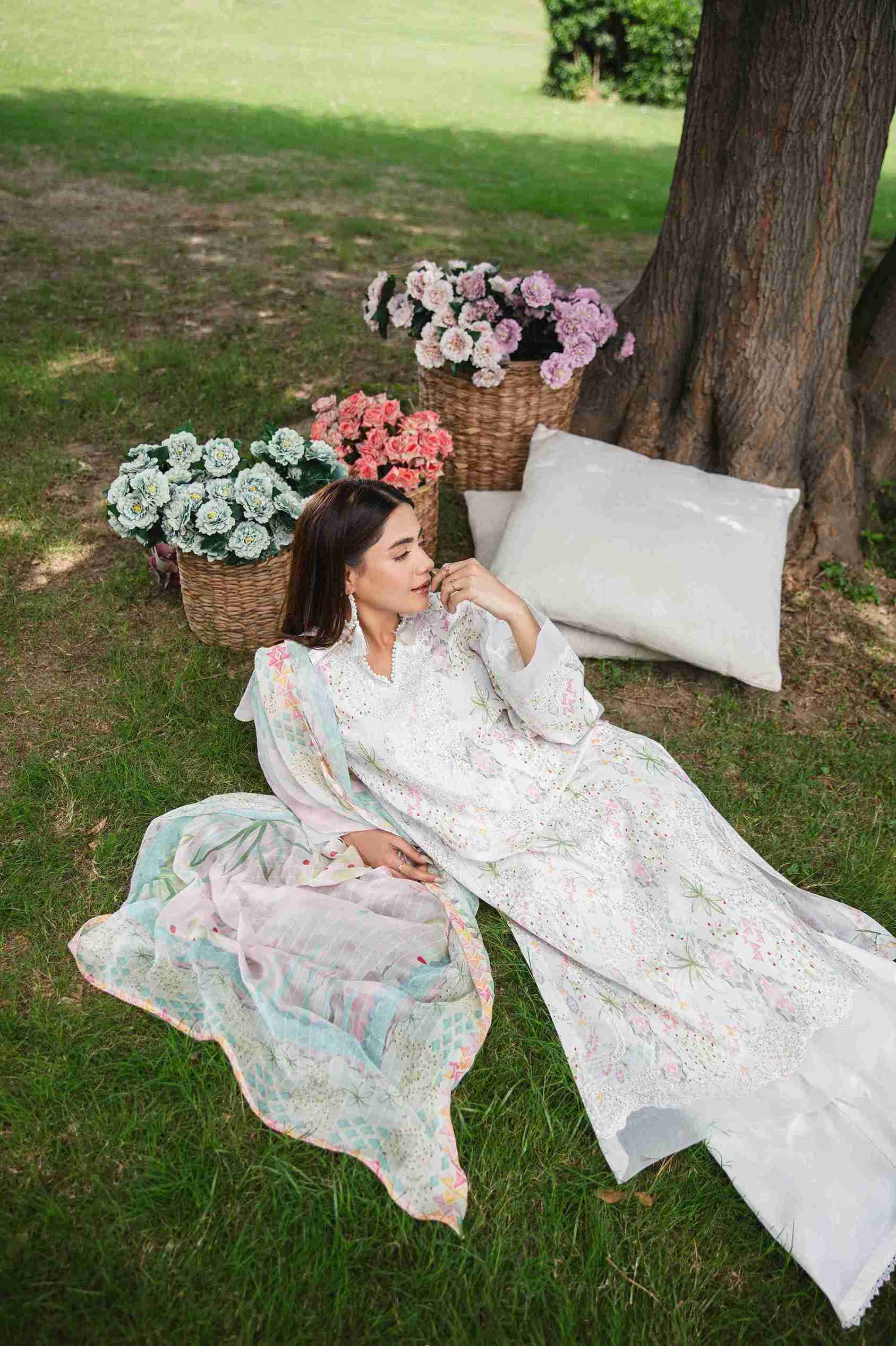 Embroidered lawn dress with chiffon dupatta and plain dyed trouser.