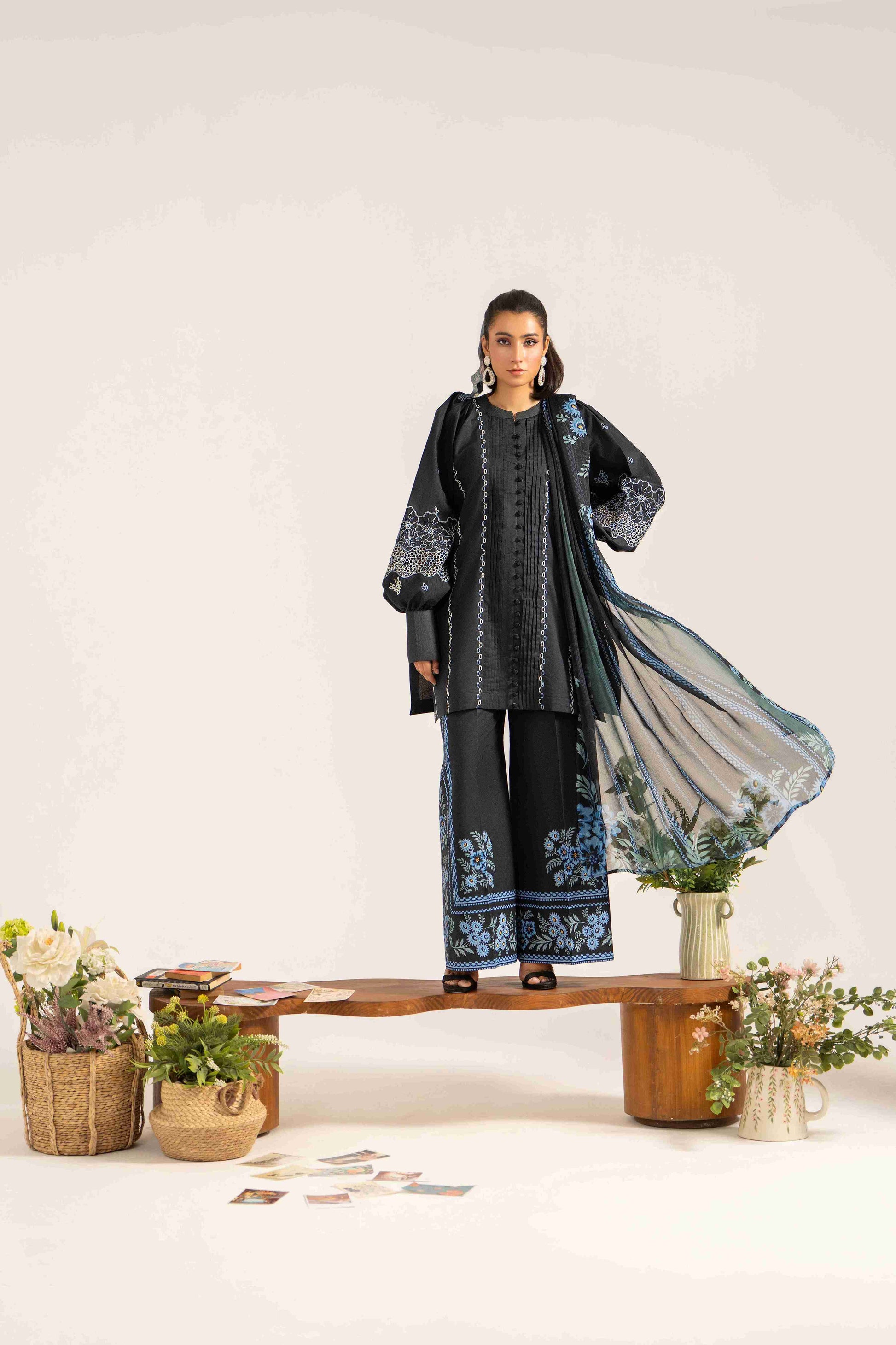 Classic embroidered lawn shirt styled with chiffon printed dupatta and plain cotton trouser.