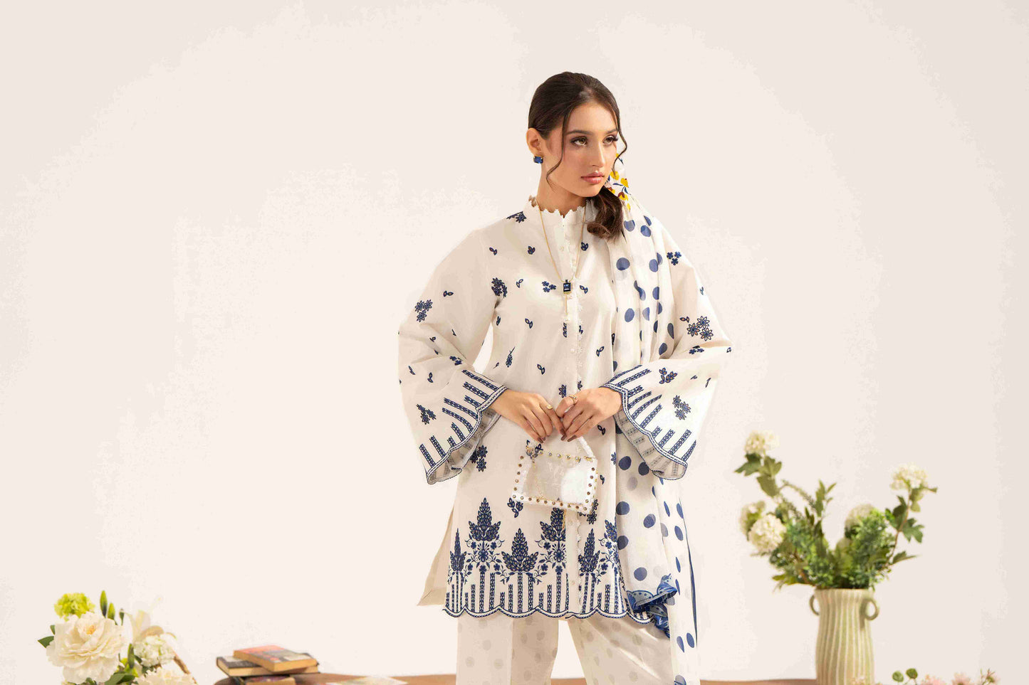 Classy embroidered lawn shirt styled with chiffon dupatta and plain cotton trouser.