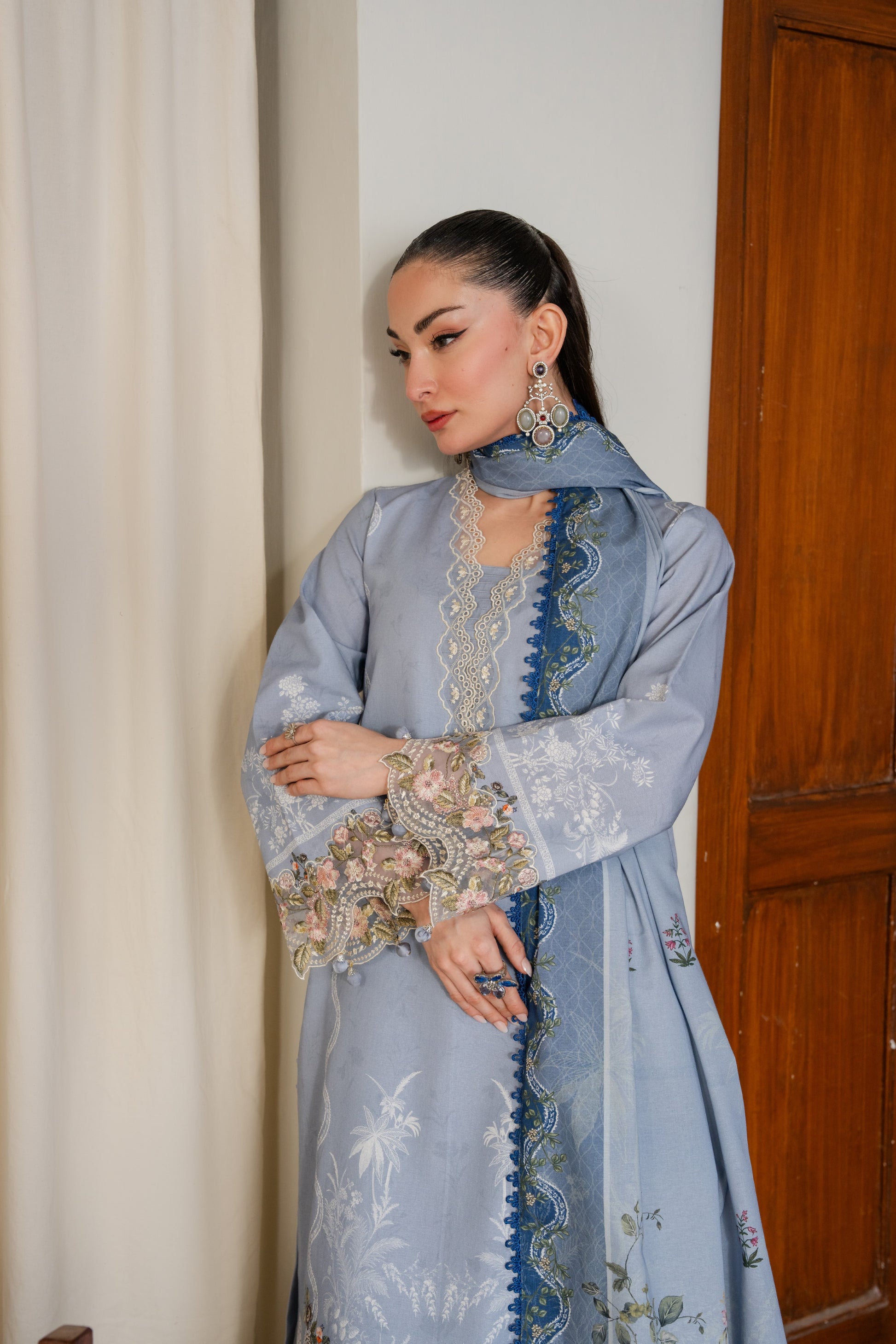 Warm khaddar dress with organza work and printed dupatta for winter comfort.