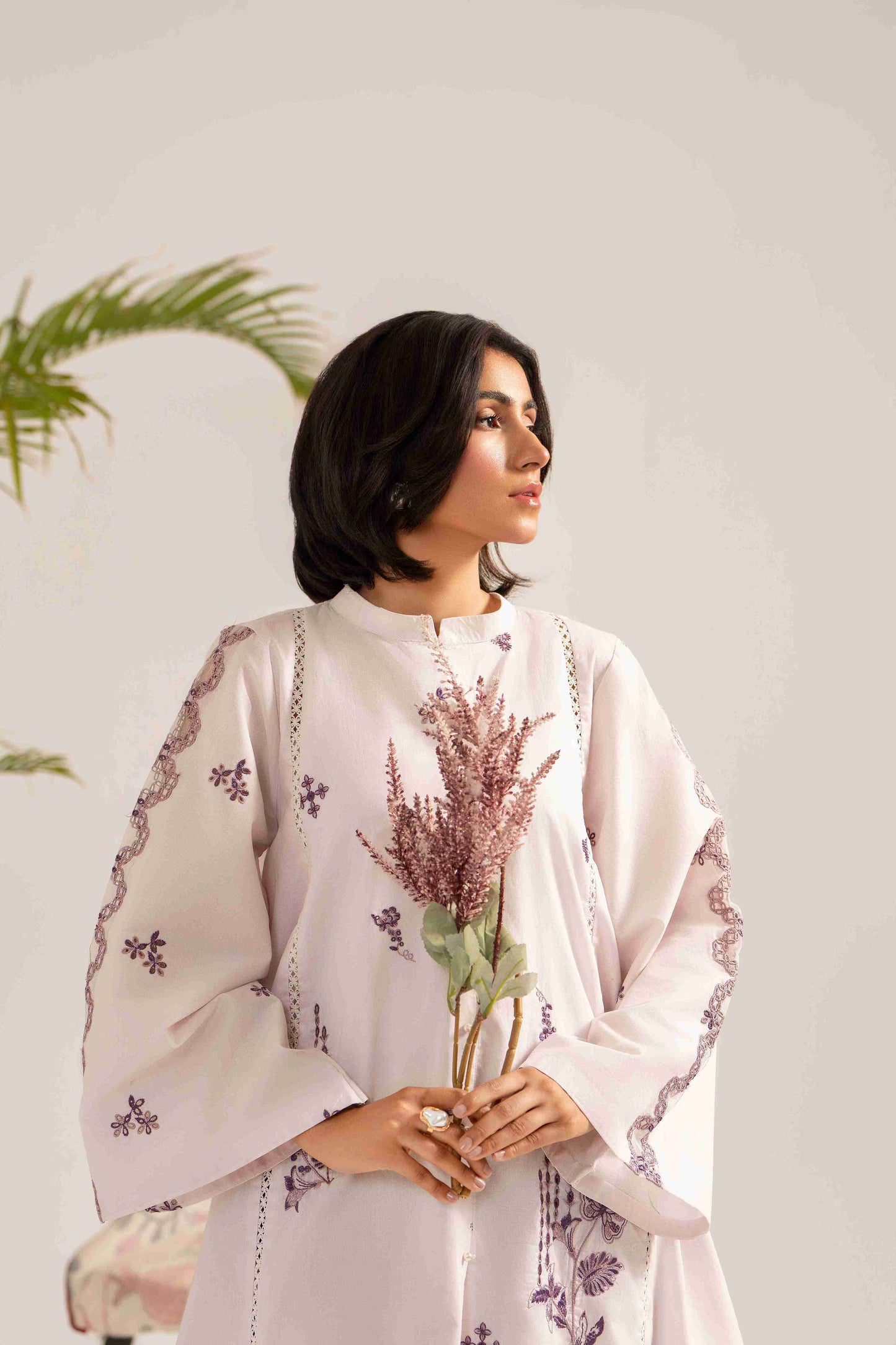 Designer embroidered lawn shirt matched with chiffon printed dupatta and cotton trouser.