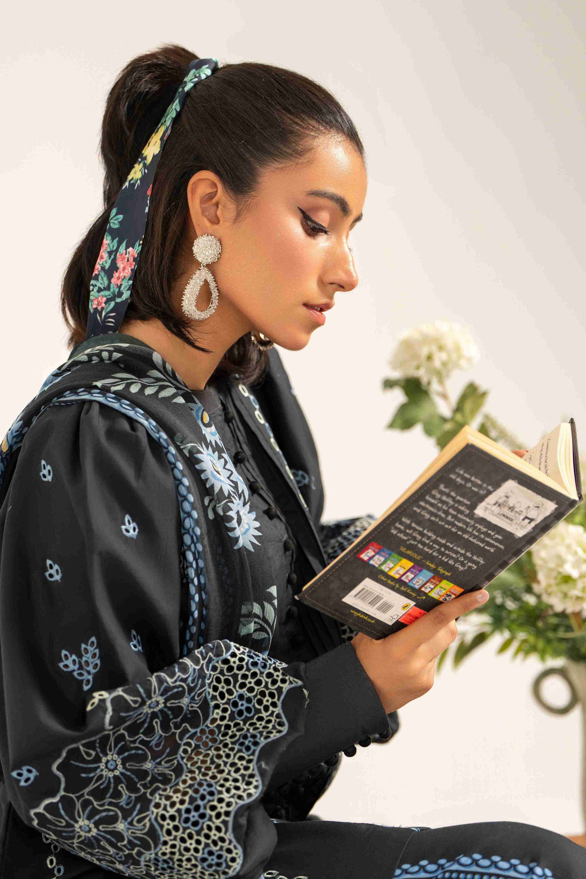 Designer embroidered lawn shirt styled with chiffon dupatta and soft plain cotton trouser.