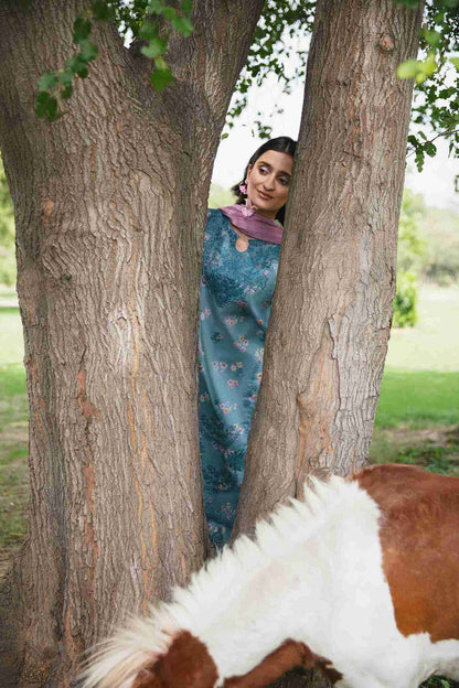 Embroidered lawn suit styled with chiffon dupatta and cotton plain trouser.