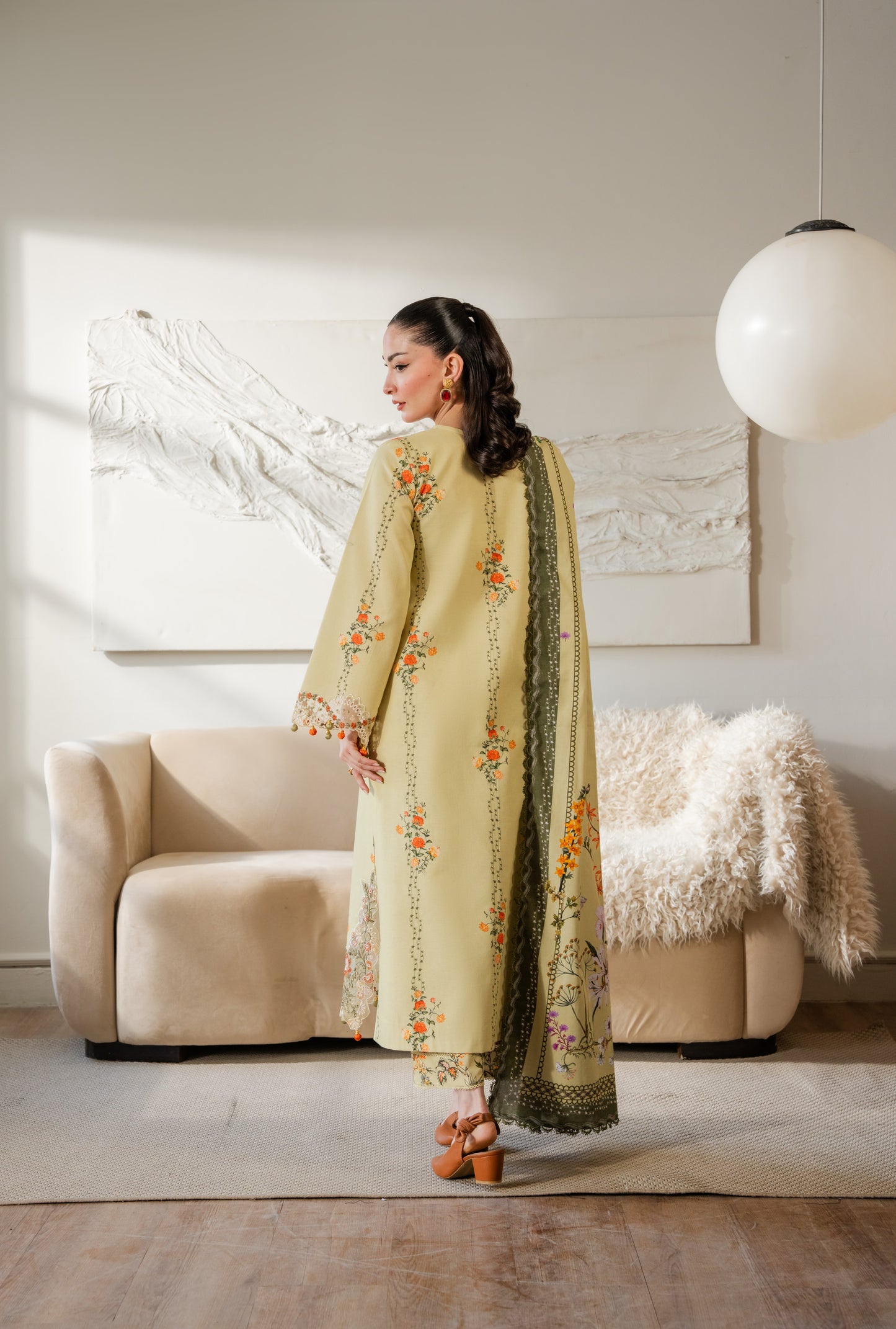 Simple khaddar printed dress with clean organza work and dyed trousers.