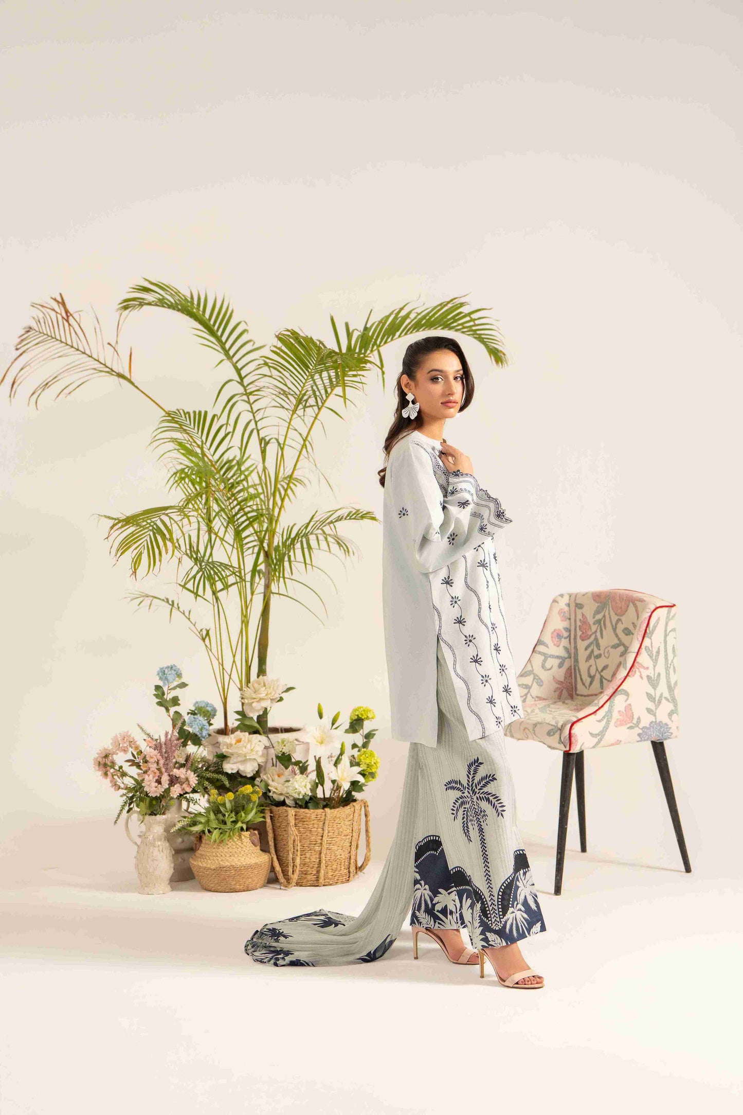 Elegant embroidered lawn shirt matched with chiffon dupatta and cotton plain trouser.