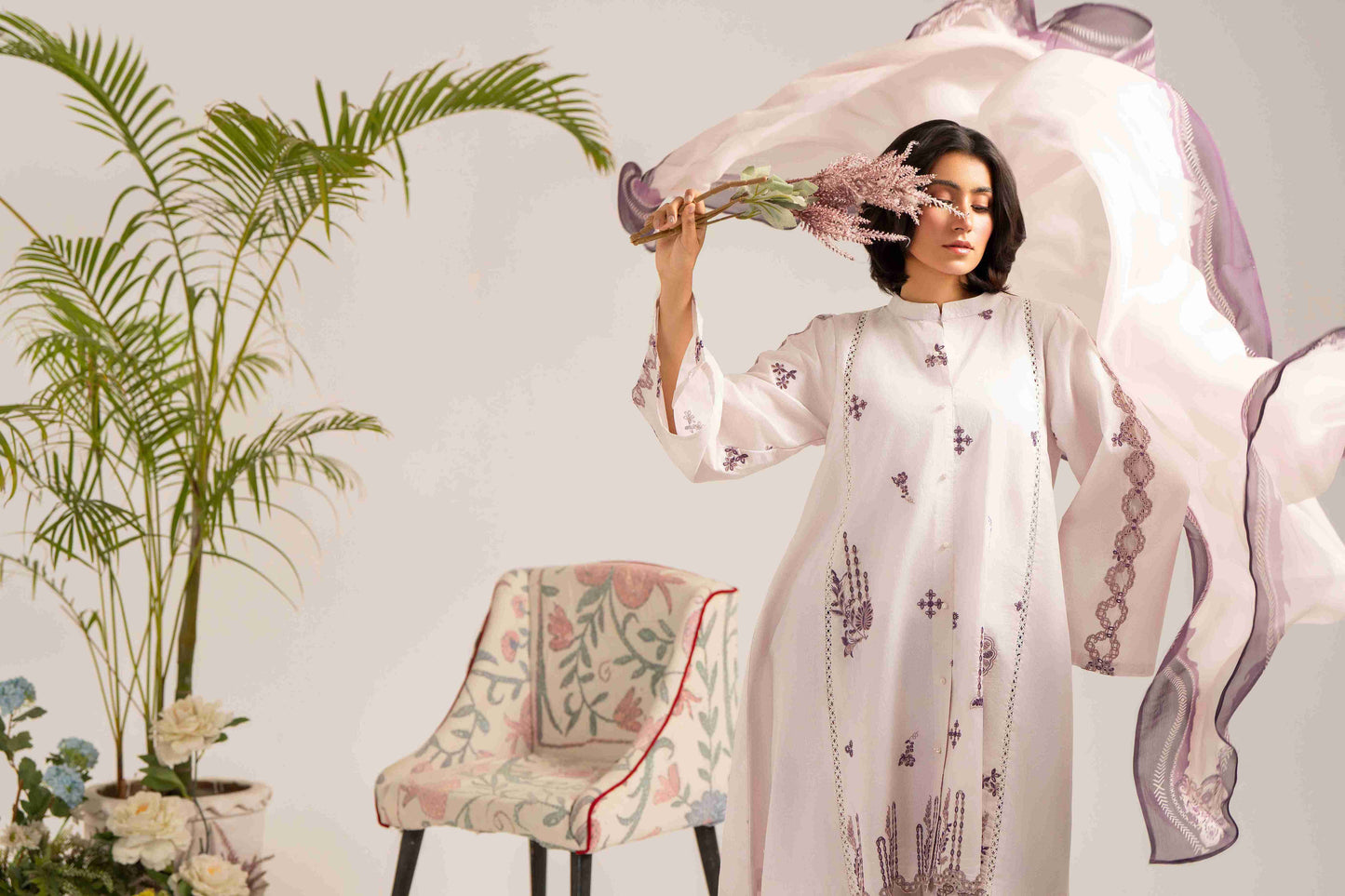  Elegant embroidered lawn shirt styled with chiffon dupatta and soft cotton trouser.