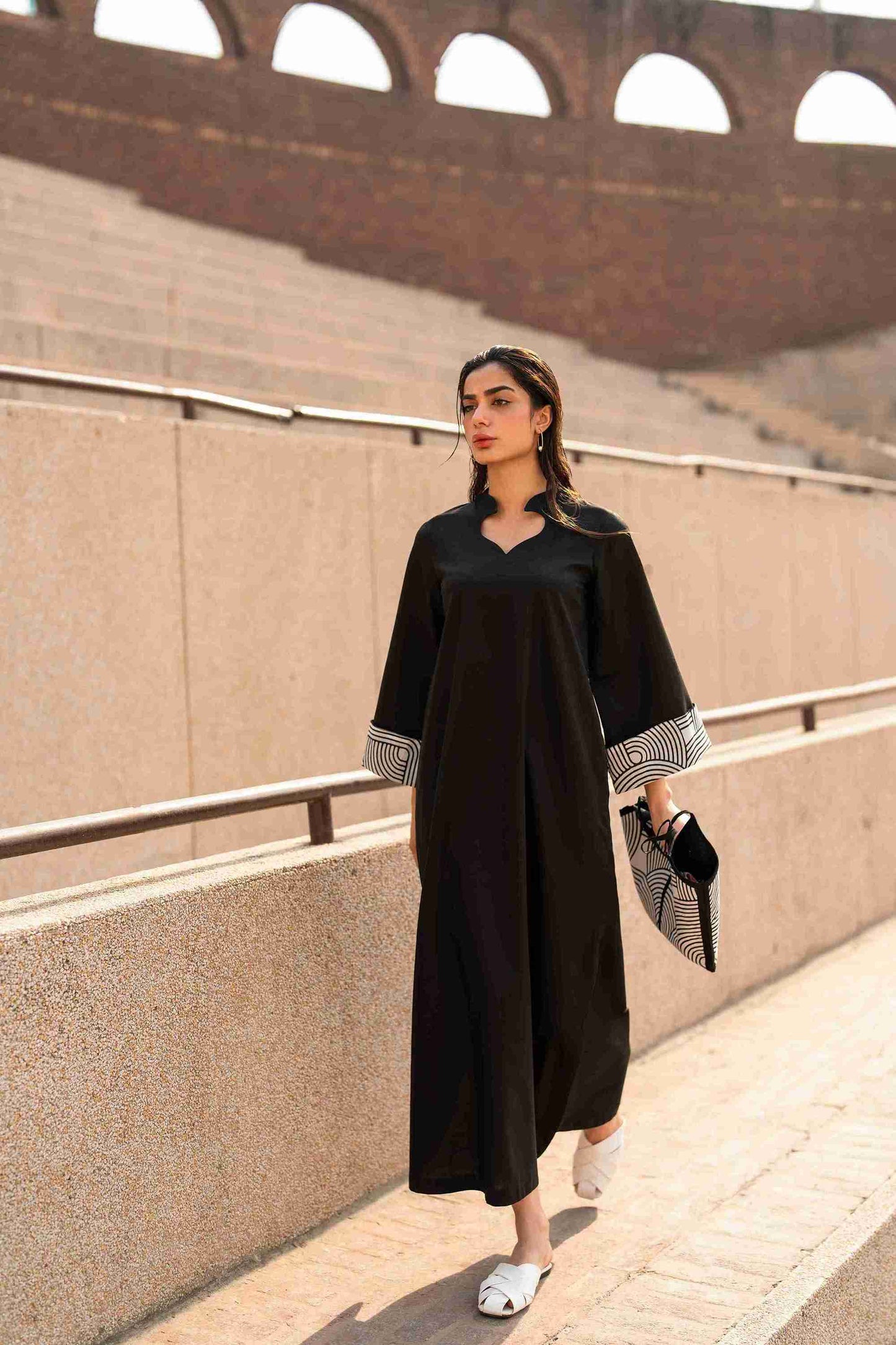 Stitched Jacquard kurta featuring embroidered neckline and bell sleeves for women