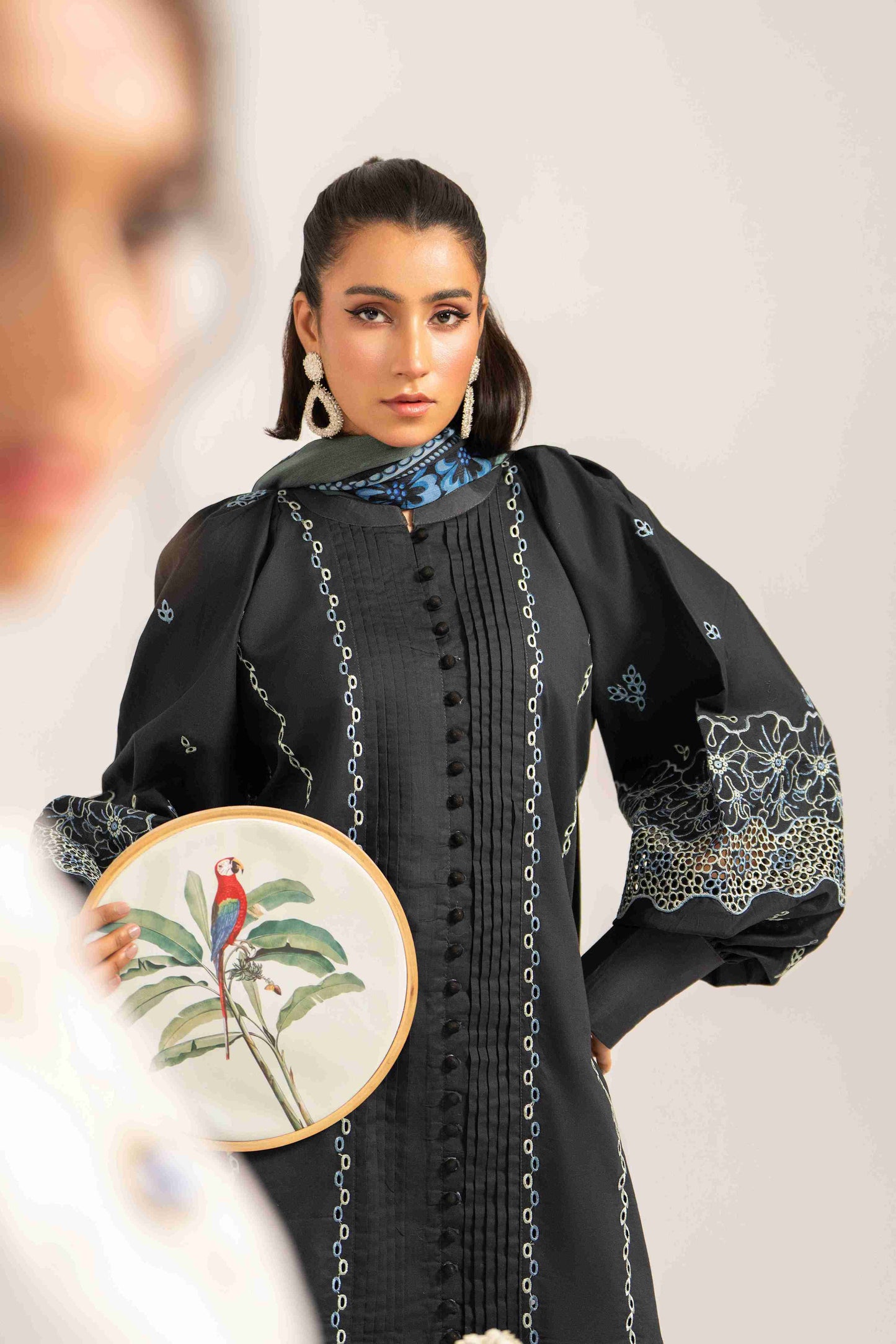  Elegant embroidered lawn shirt styled with chiffon dupatta and comfortable cotton trouser.