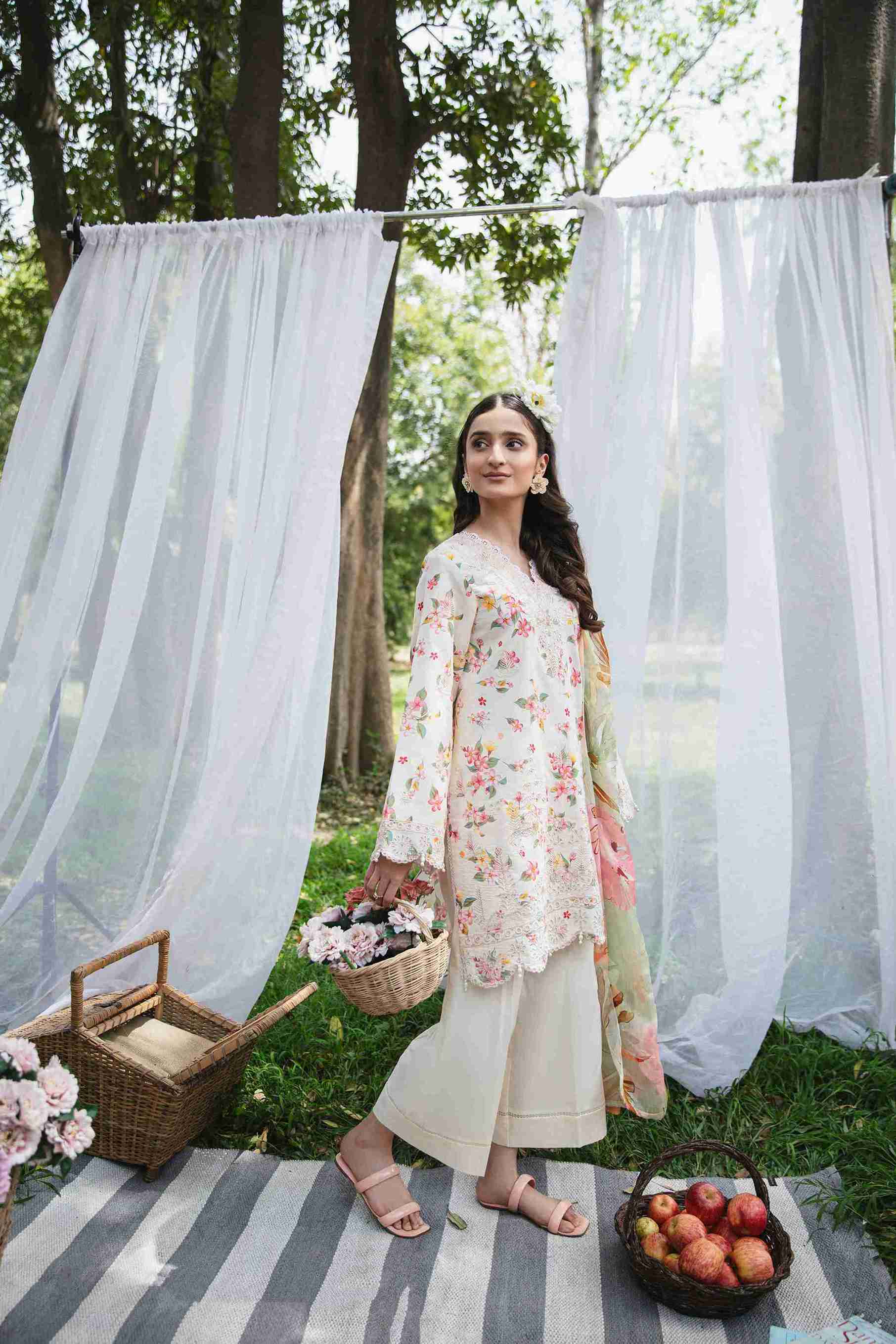 Embroidered lawn shirt styled with chiffon dupatta and cotton plain trouser.