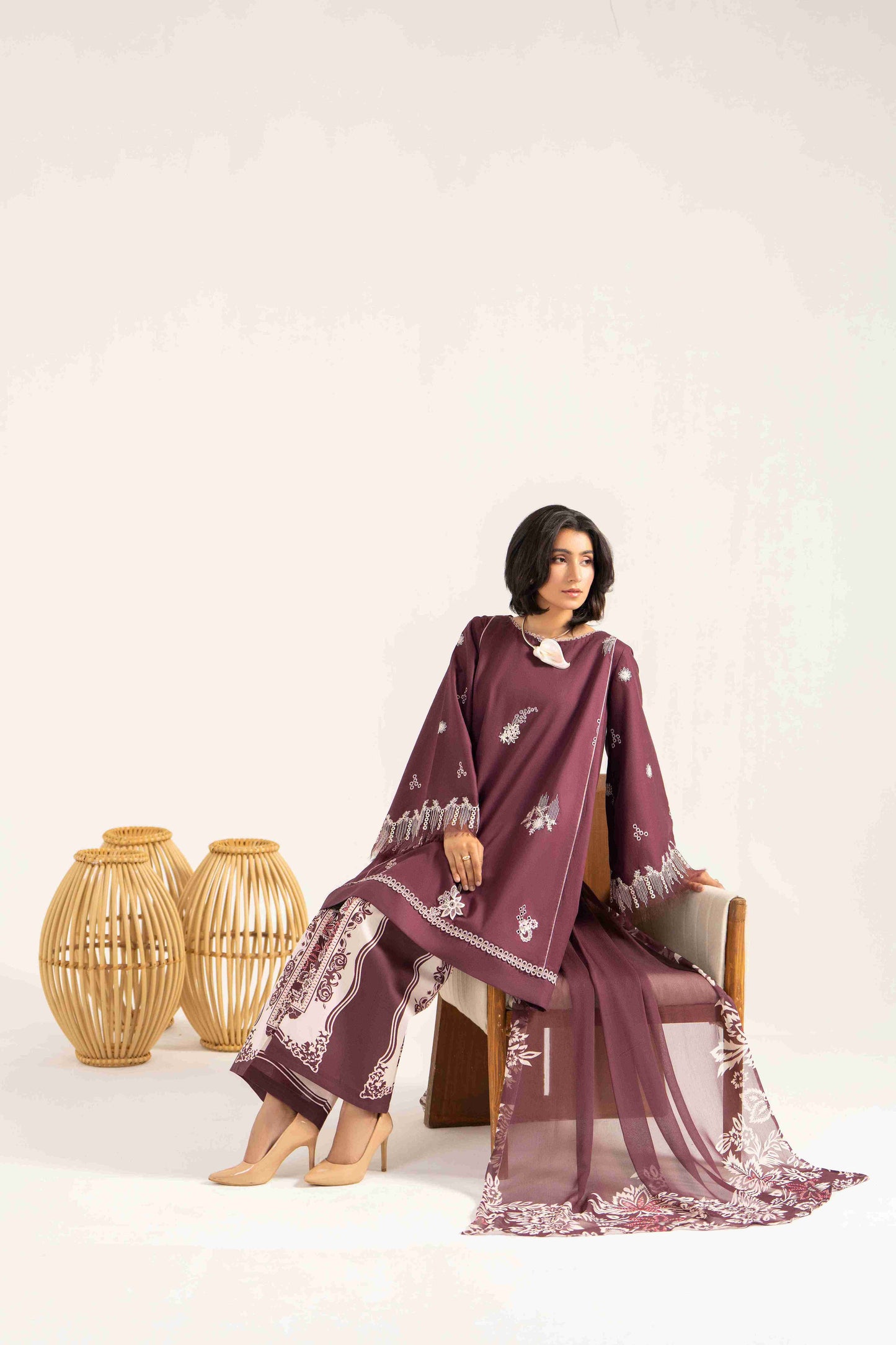 Elegant embroidered lawn shirt paired with chiffon printed dupatta and cotton trouser.