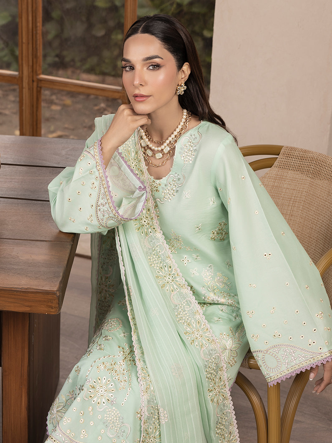 Casual printed lawn suit with embroidered detailing, styled for daily summer wear