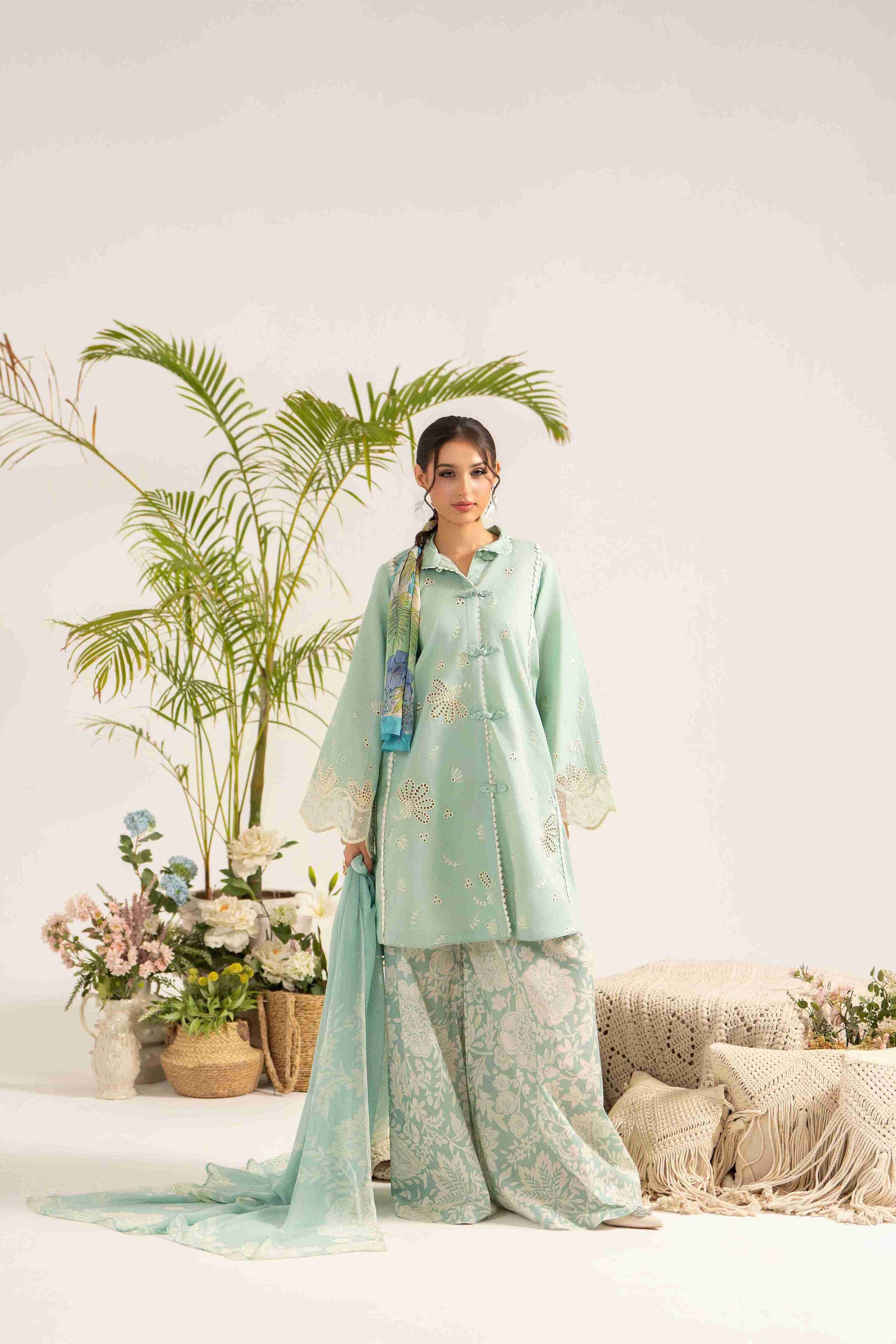Elegant embroidered lawn shirt styled with chiffon printed dupatta and trouser.
