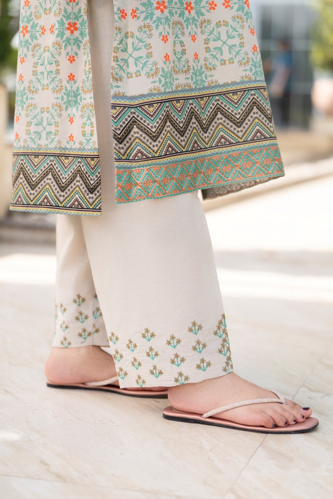 Premium embroidered lawn kurta with chiffon dupatta and cotton trouser, styled for modern eastern charm