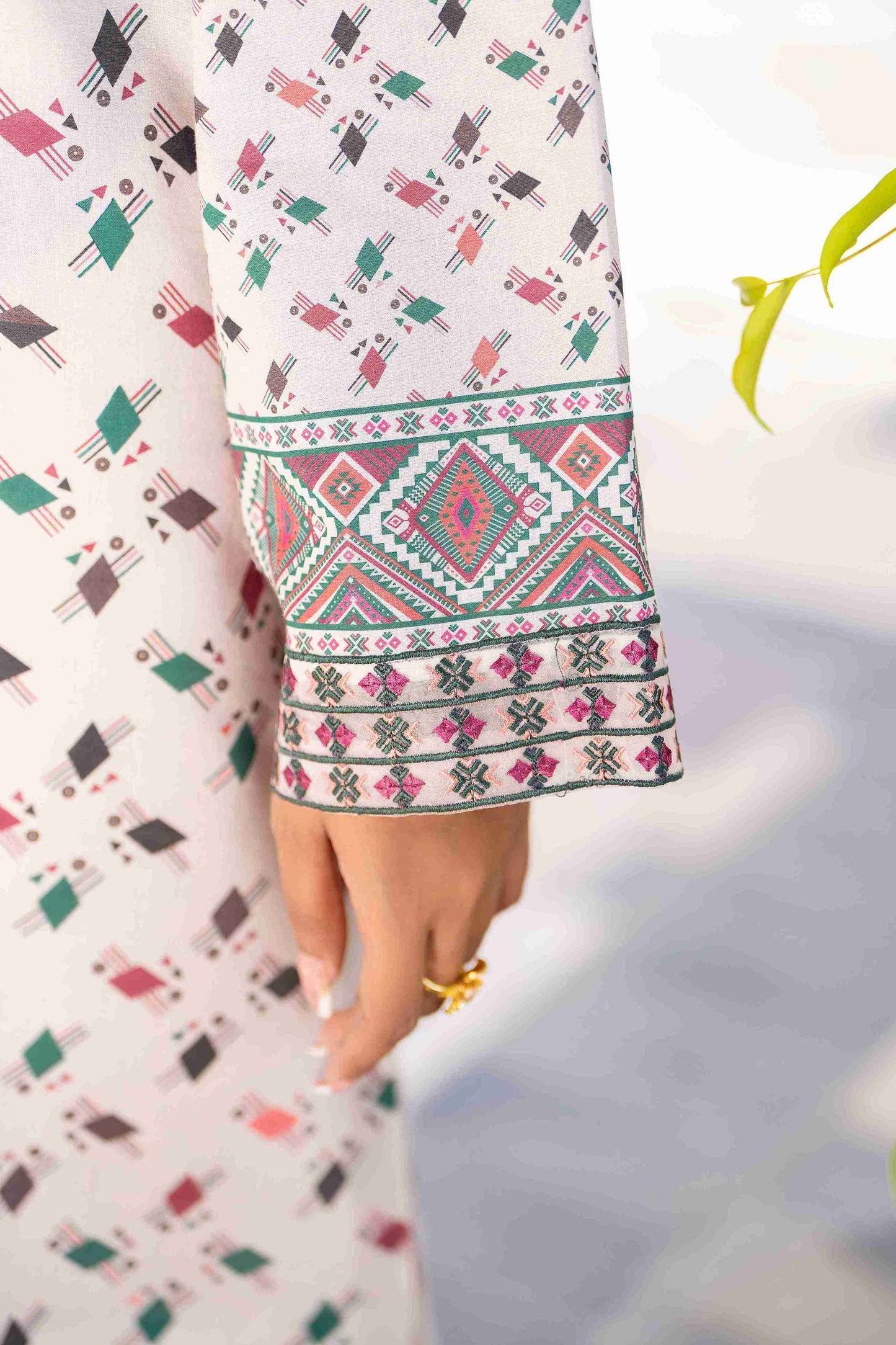 Premium branded lawn outfit with embroidered neckline, chiffon dupatta, and cotton trouser