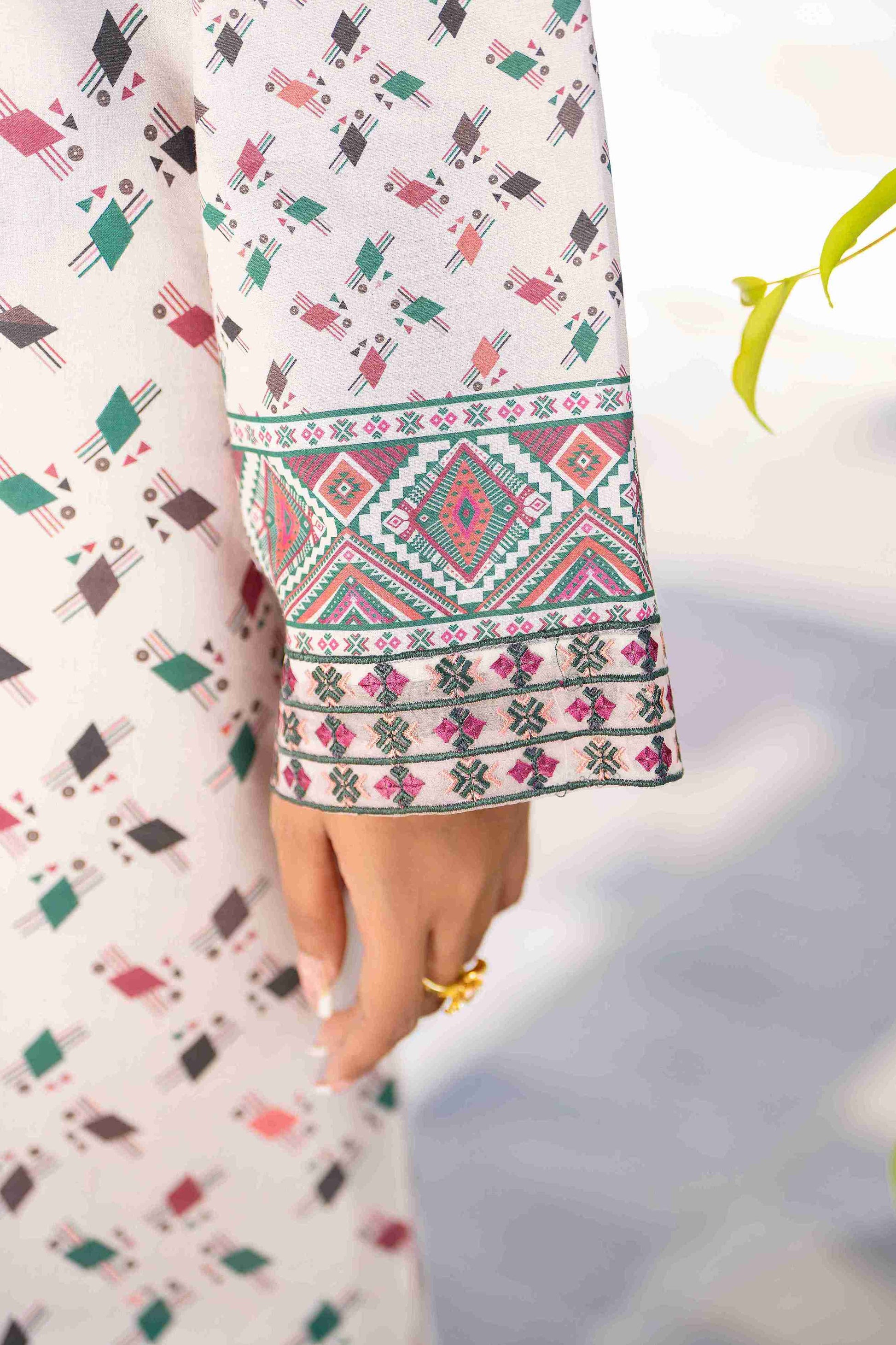 Premium branded lawn outfit with embroidered neckline, chiffon dupatta, and cotton trouser