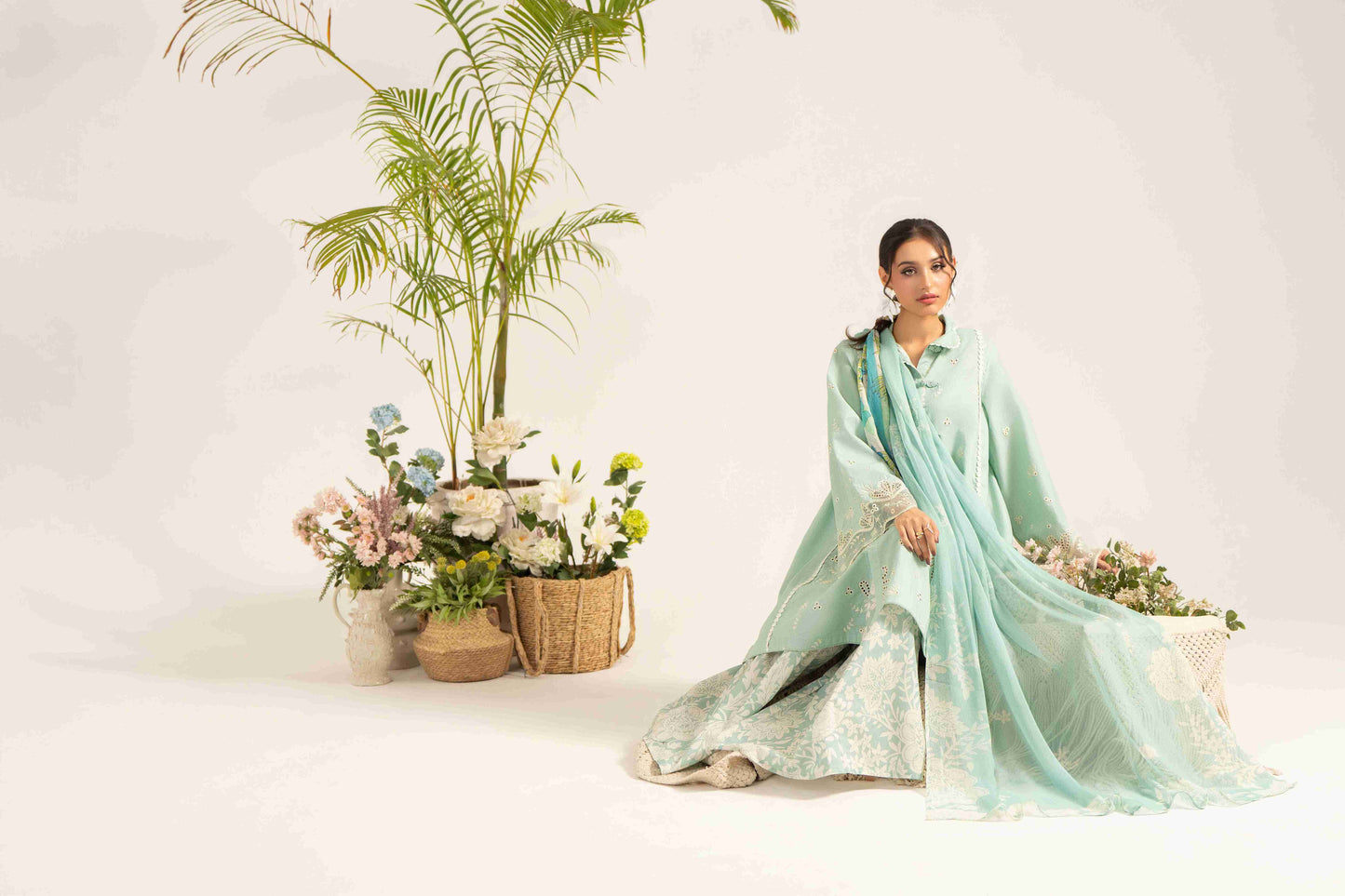 Elegant embroidered lawn shirt paired with chiffon dupatta and soft cotton trouser.