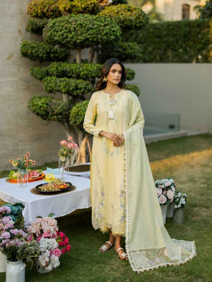Elegant yellow lawn outfit featuring organza patch, motifs, and trendy cotton dupatta