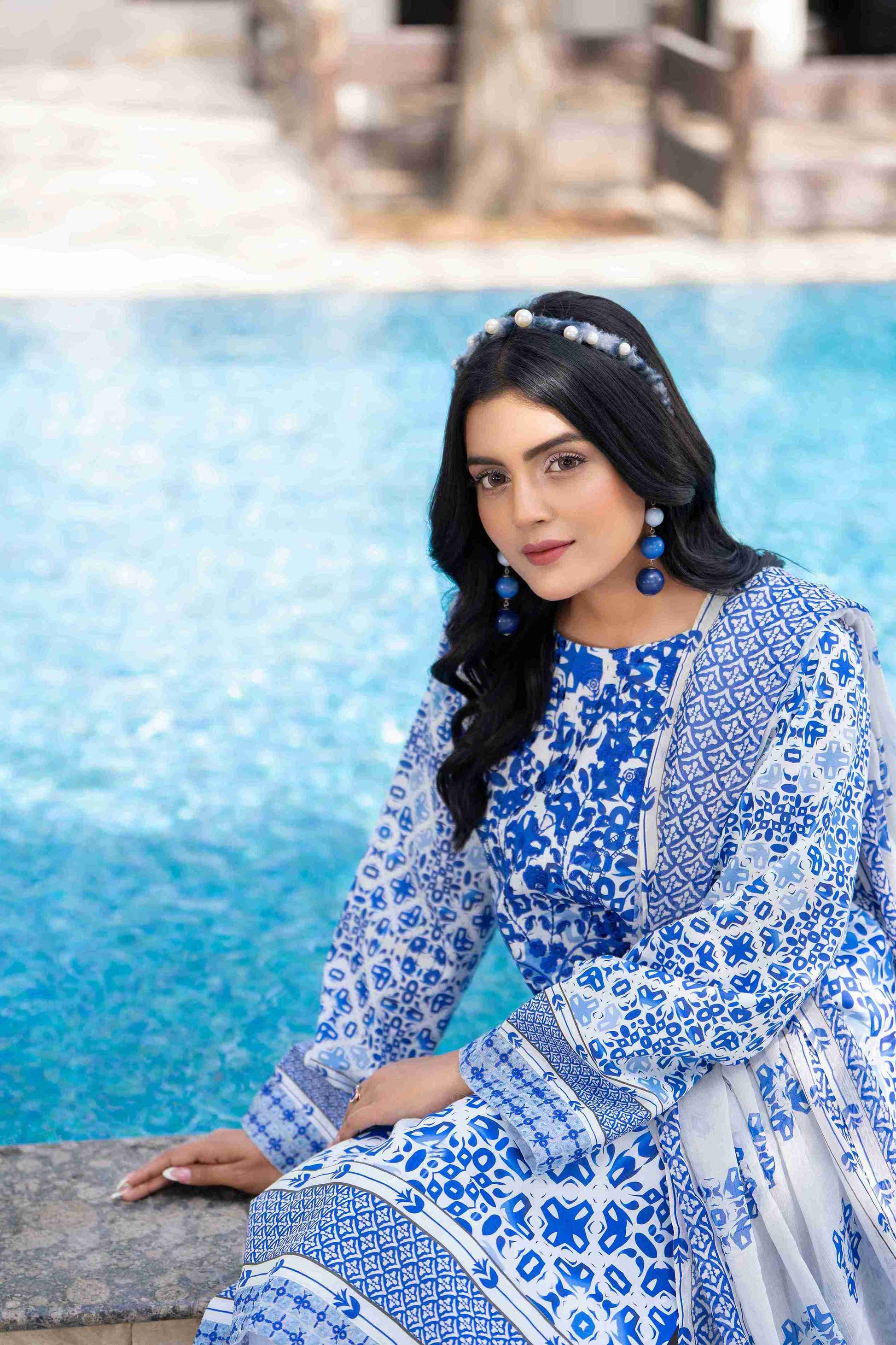 Lawn kurta in rich hues with embroidered neckline, paired with chiffon dupatta and cotton trouser