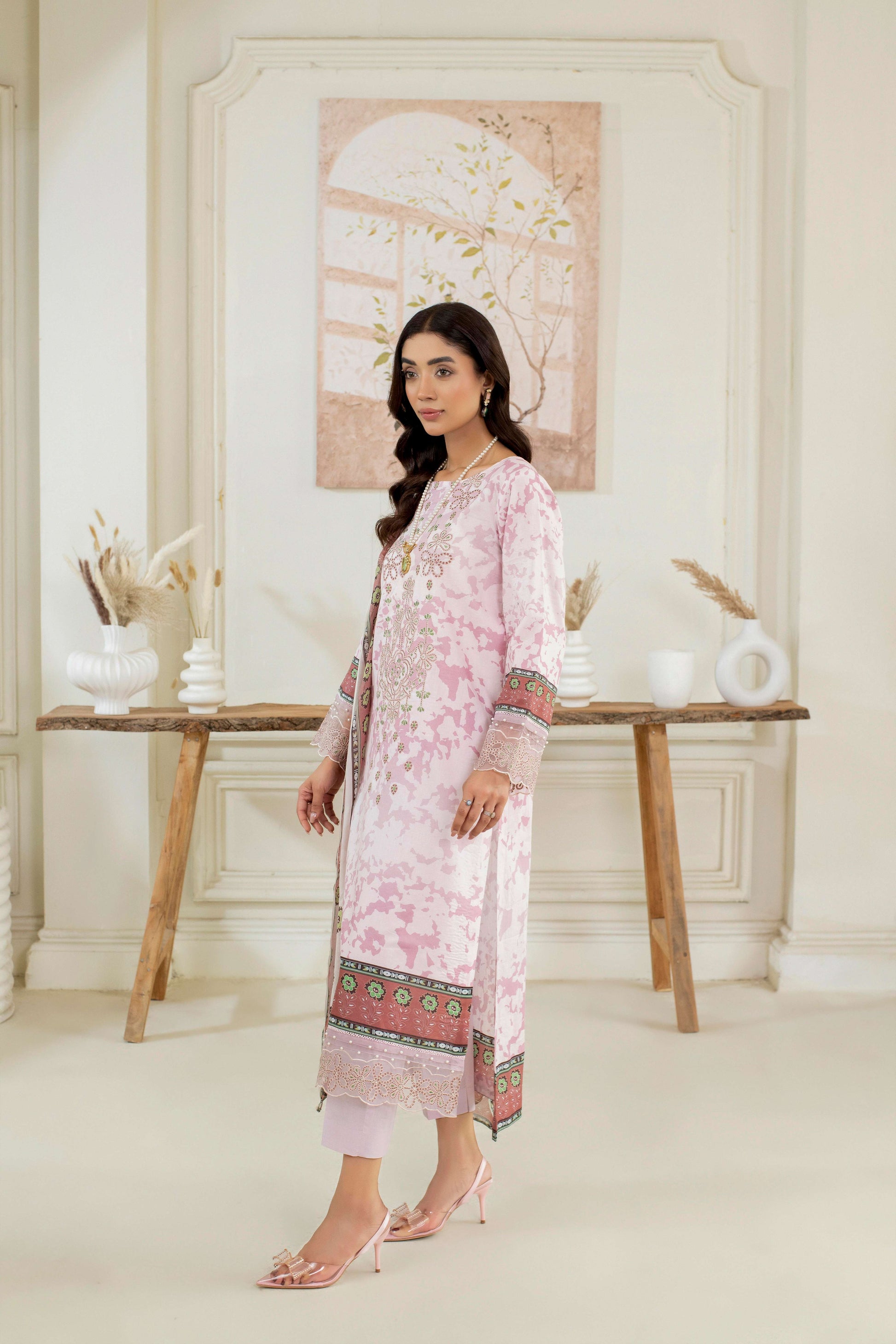 Stitched lawn kurta with embroidery, trouser, and dupatta.