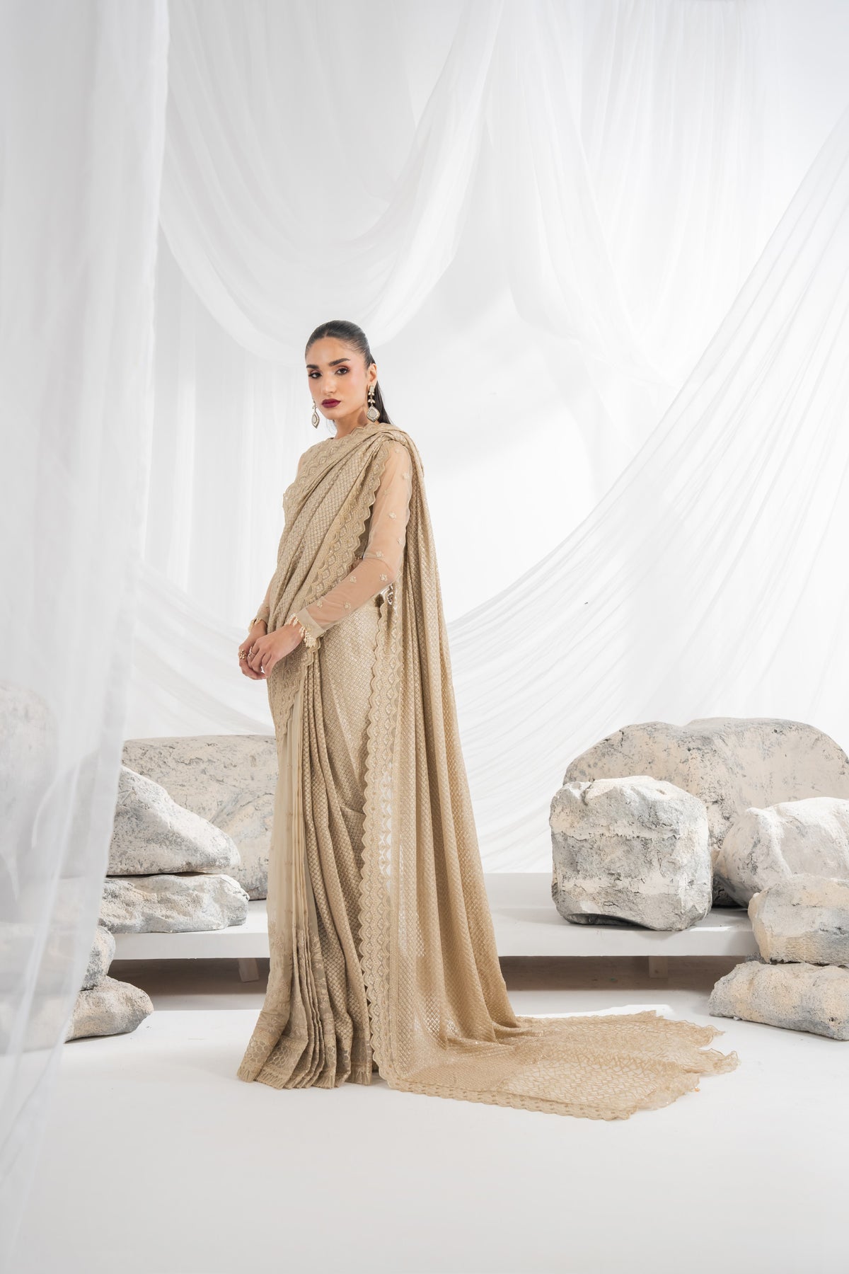 Embroidered wedding dress for girls featuring detailed embroidery on the net front, back, and sleeves, complemented by an embroidered chiffon dupatta with sari fall and borders, organza sari pallu, and plain raw silk inner