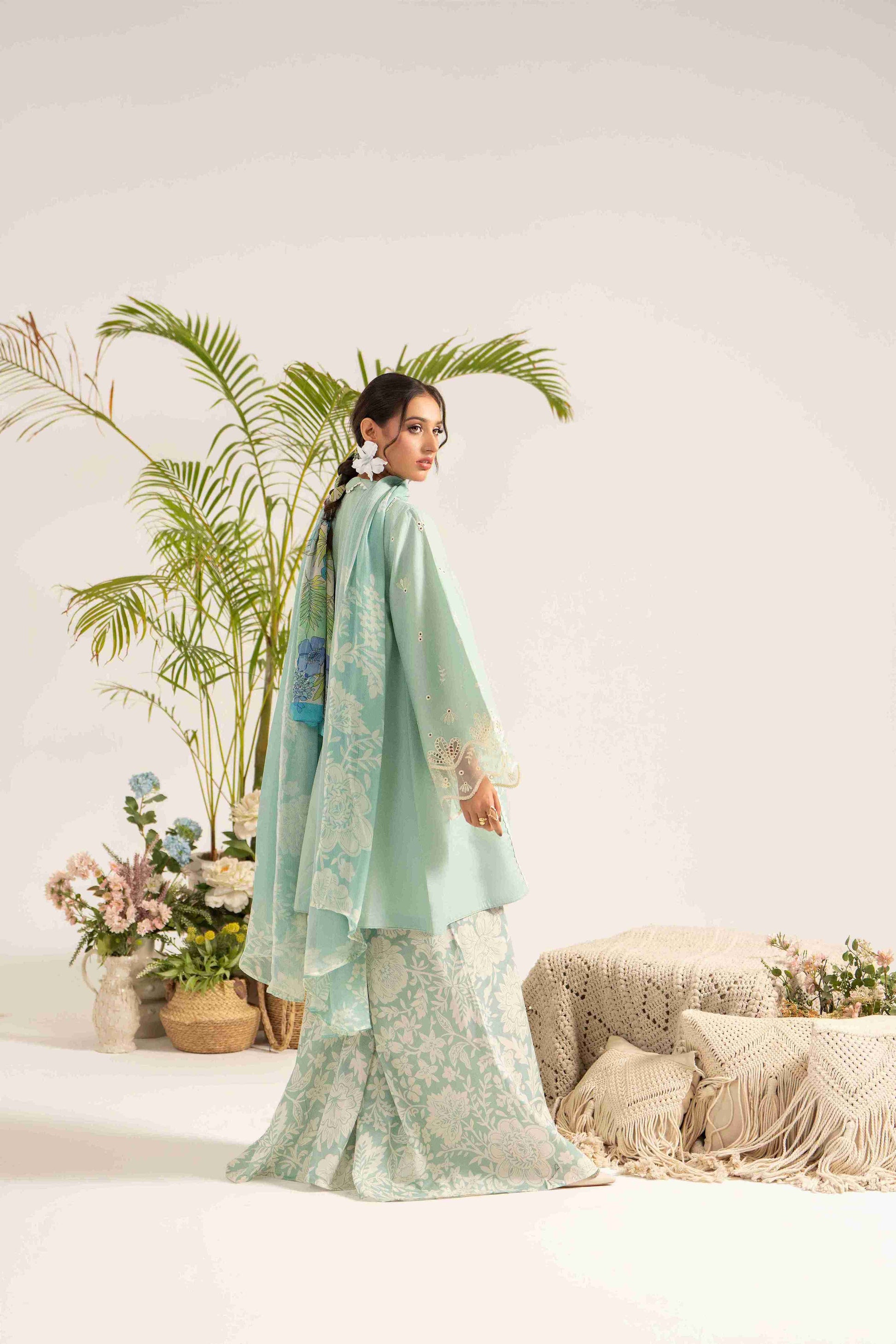  Fancy embroidered lawn shirt matched with chiffon dupatta and plain cotton trouser.