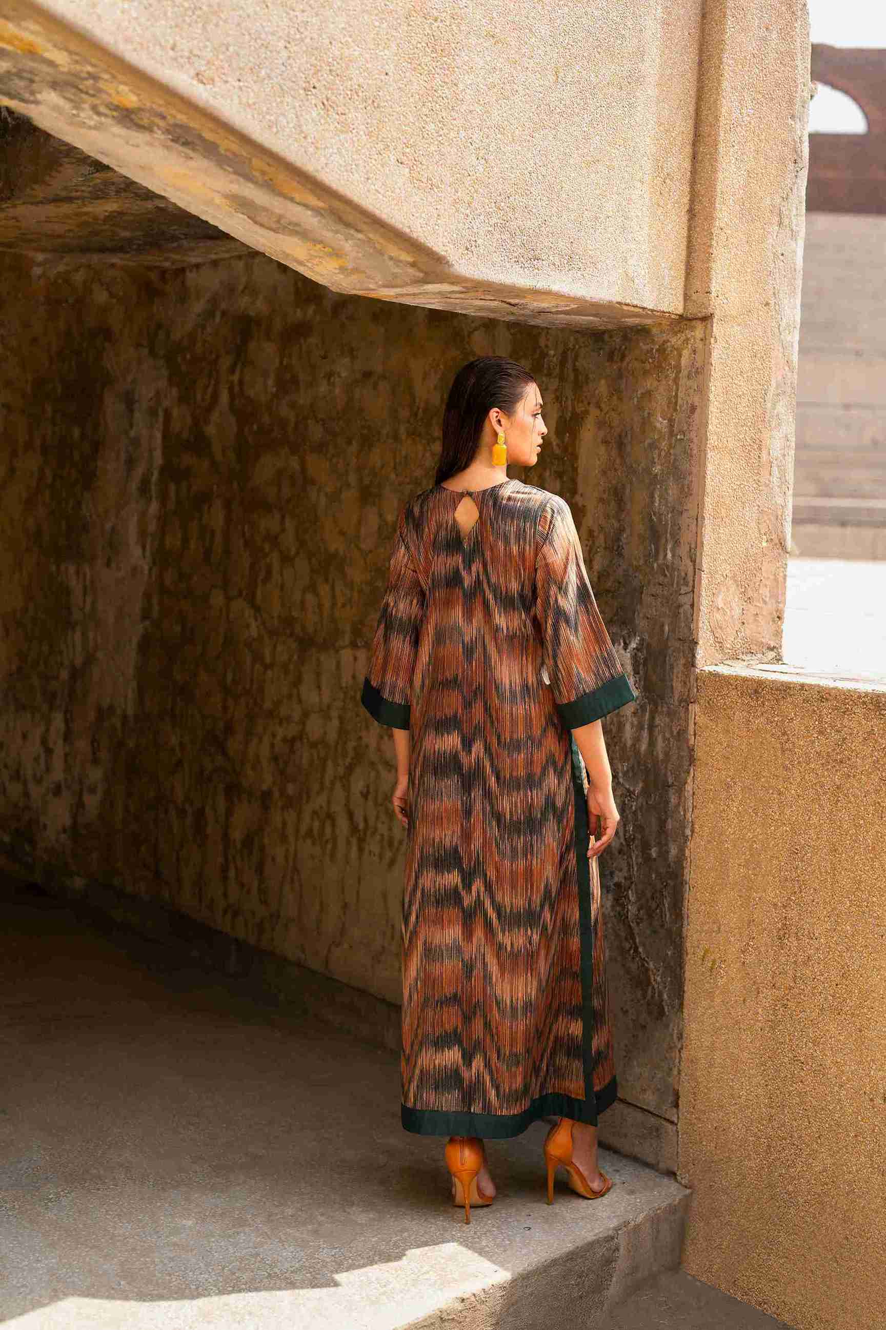 Elegant stitched Jacquard tunic styled with bell bottom trouser for weddings