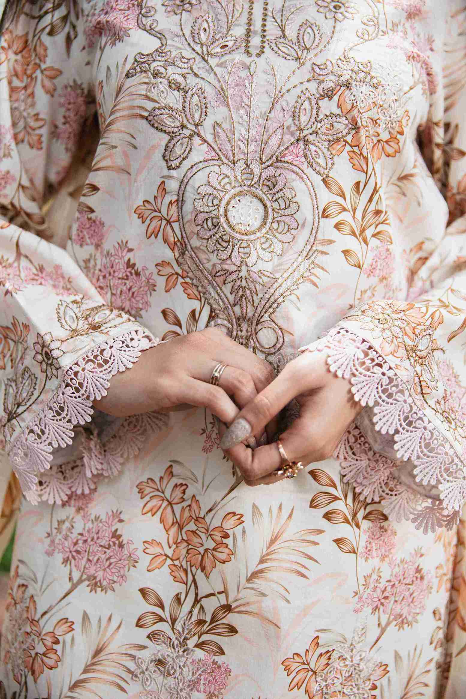 Embroidered lawn kurta styled with chiffon dupatta and cotton trouser.