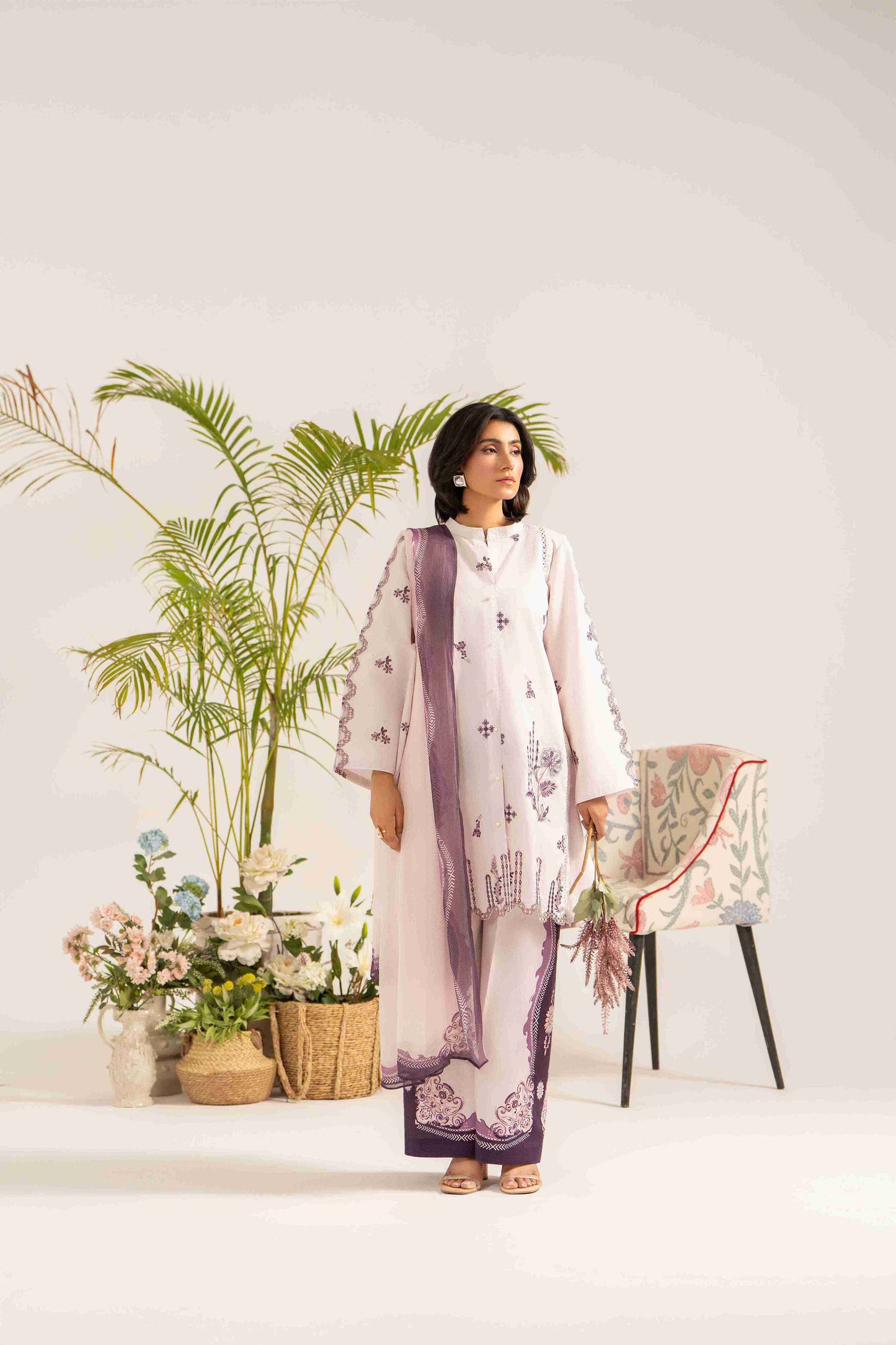 Fancy embroidered lawn shirt styled with chiffon dupatta and soft cotton trouser.