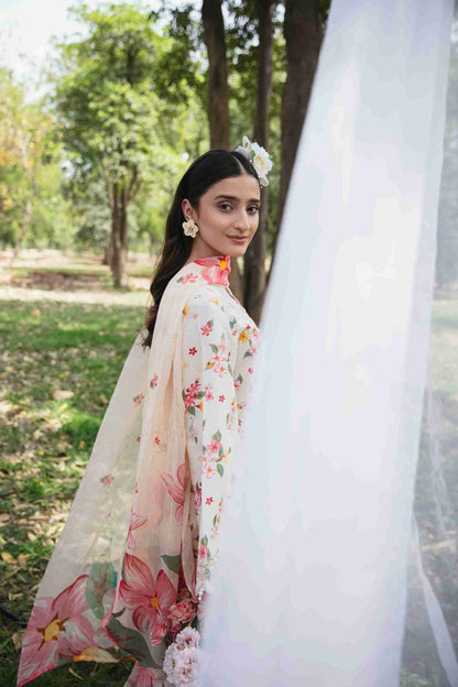 Embroidered lawn suit styled with chiffon dupatta and plain dyed trouser.