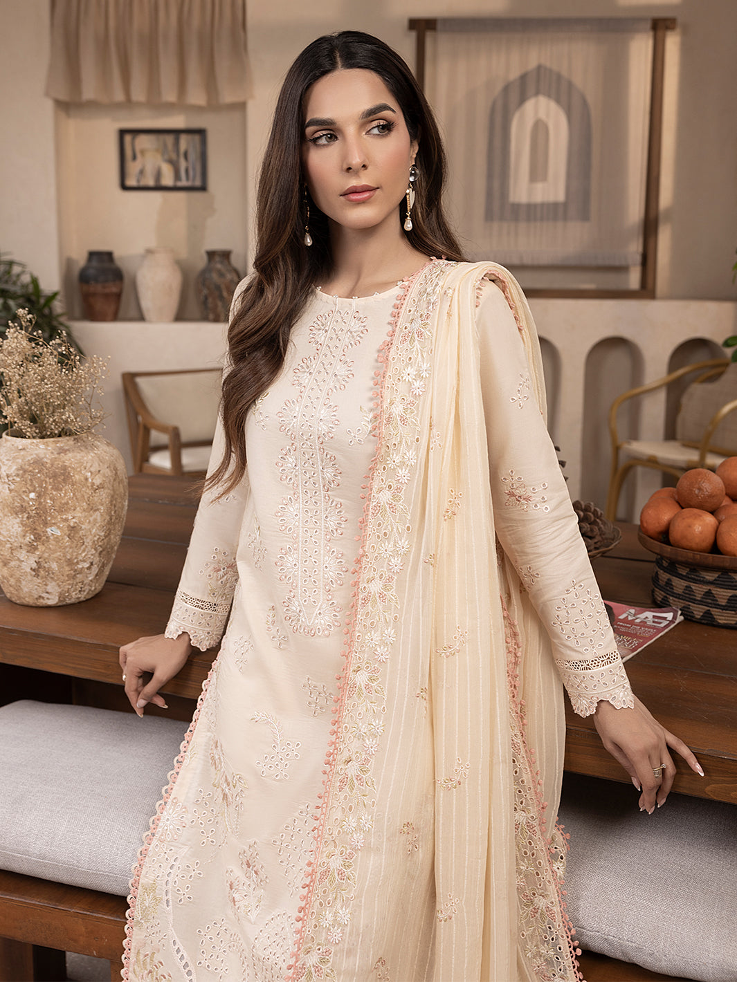 Unstitched lawn suit featuring embroidery and printed chiffon dupatta for elegant summer style