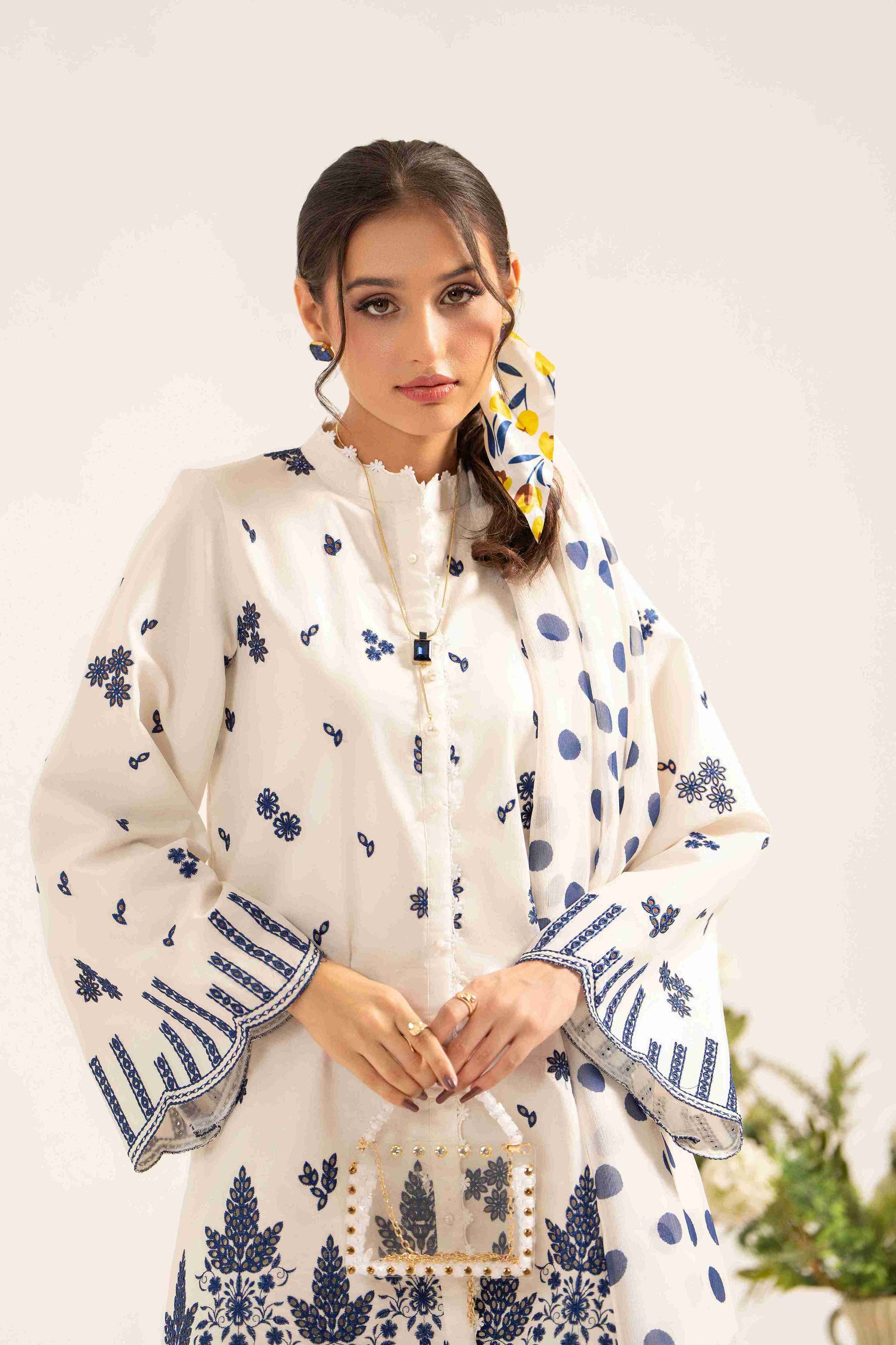  Festive embroidered lawn shirt styled with chiffon printed dupatta and cotton trouser.