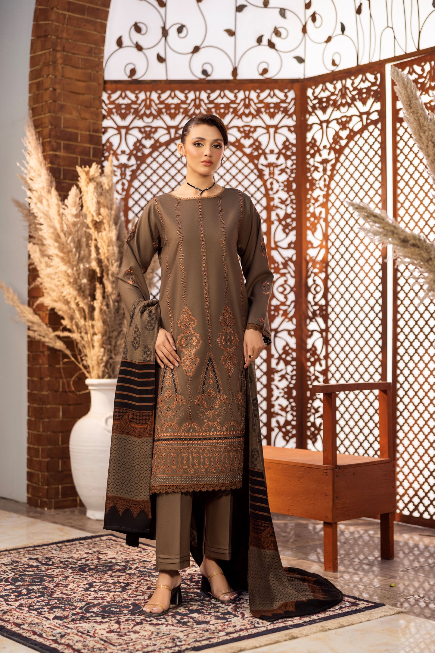 Delicate embroidery on Dhanak fabric, paired with classic Jacquard wrap