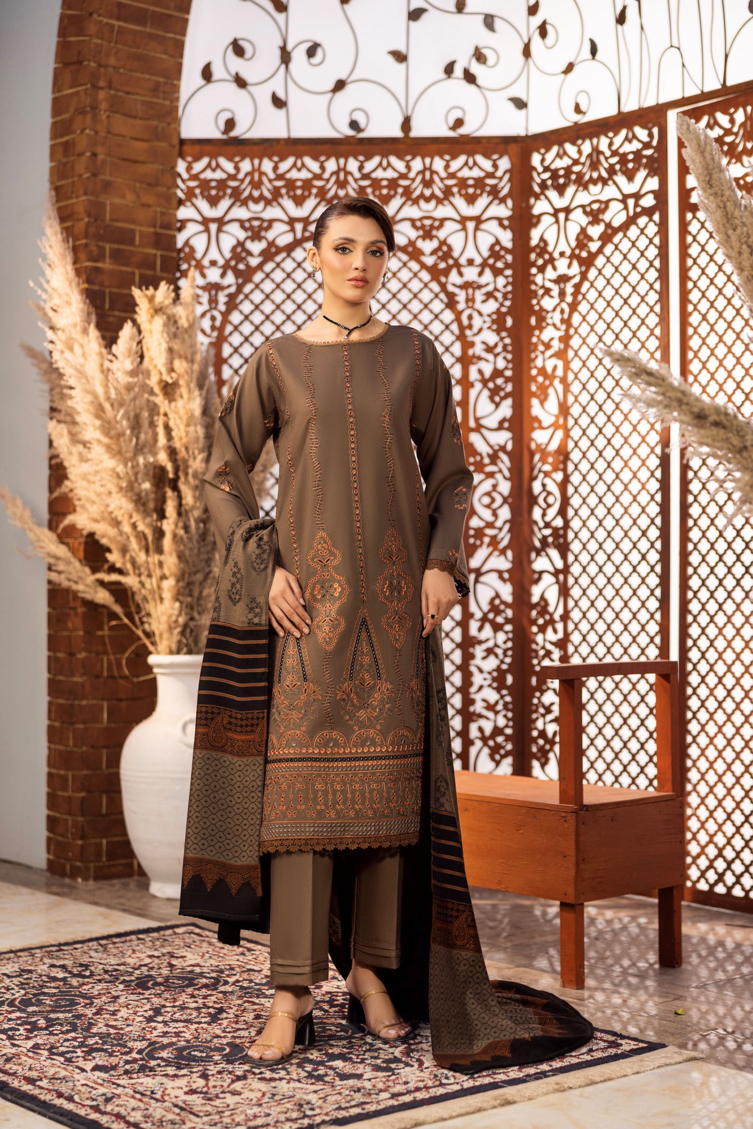 Delicate embroidery on Dhanak fabric, paired with classic Jacquard wrap