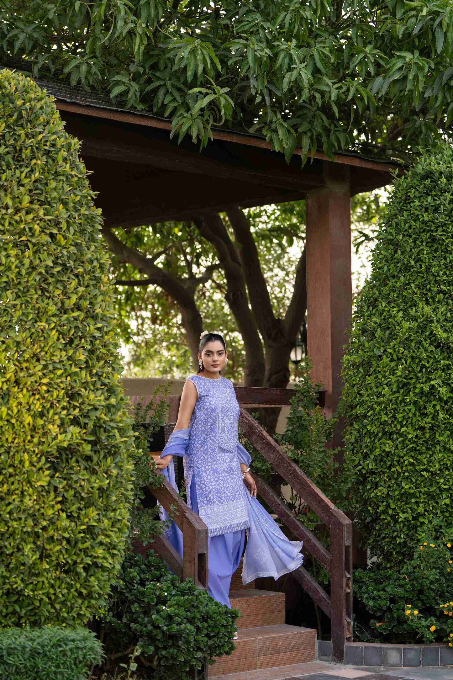 A breezy everyday look with a floral lawn shirt, plain cotton trousers, and a sheer printed chiffon dupatta for effortless summer freshness