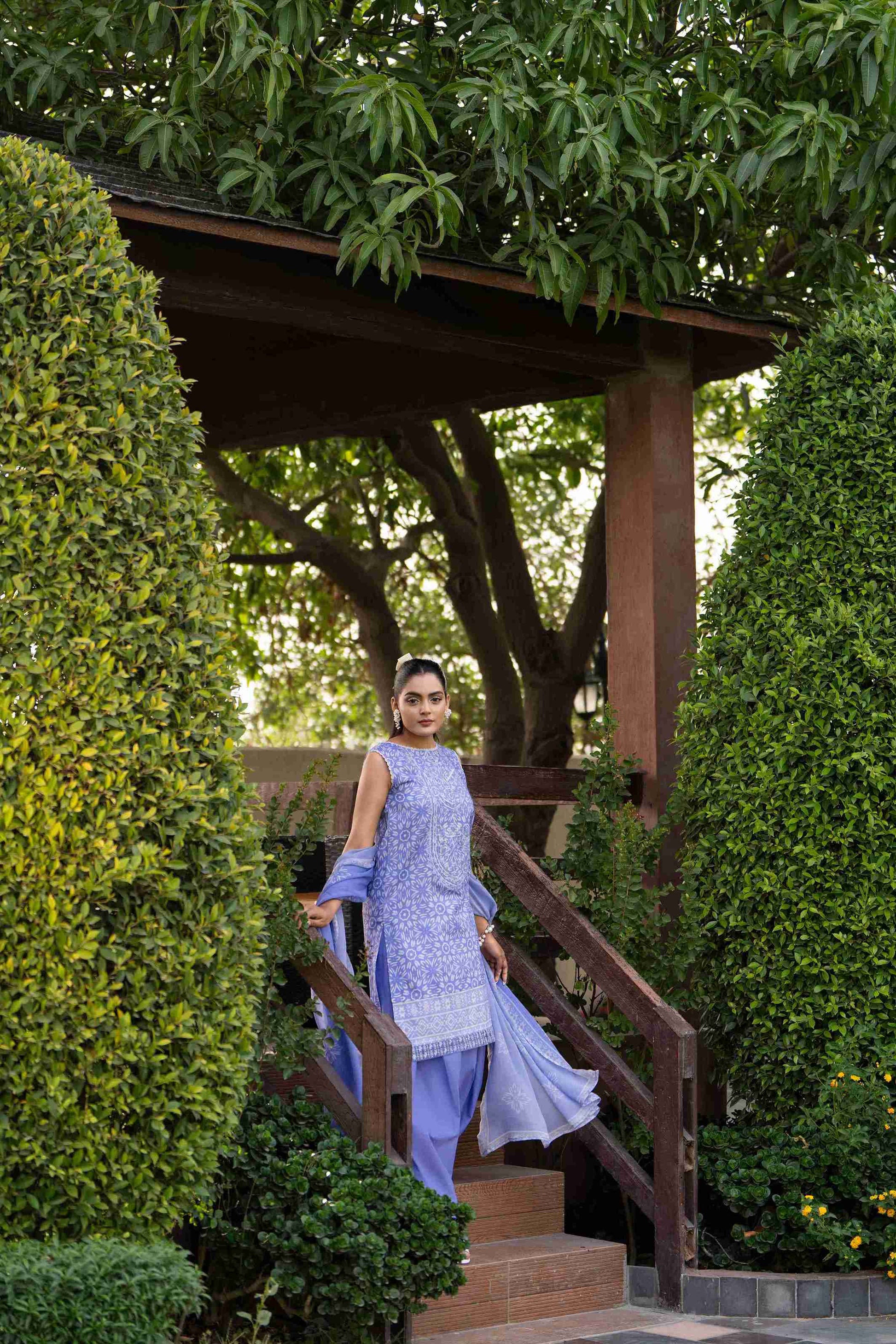 A breezy everyday look with a floral lawn shirt, plain cotton trousers, and a sheer printed chiffon dupatta for effortless summer freshness