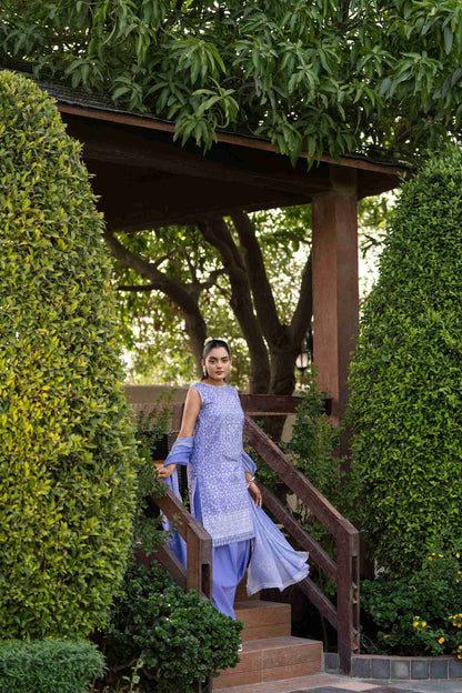 A breezy everyday look with a floral lawn shirt, plain cotton trousers, and a sheer printed chiffon dupatta for effortless summer freshness