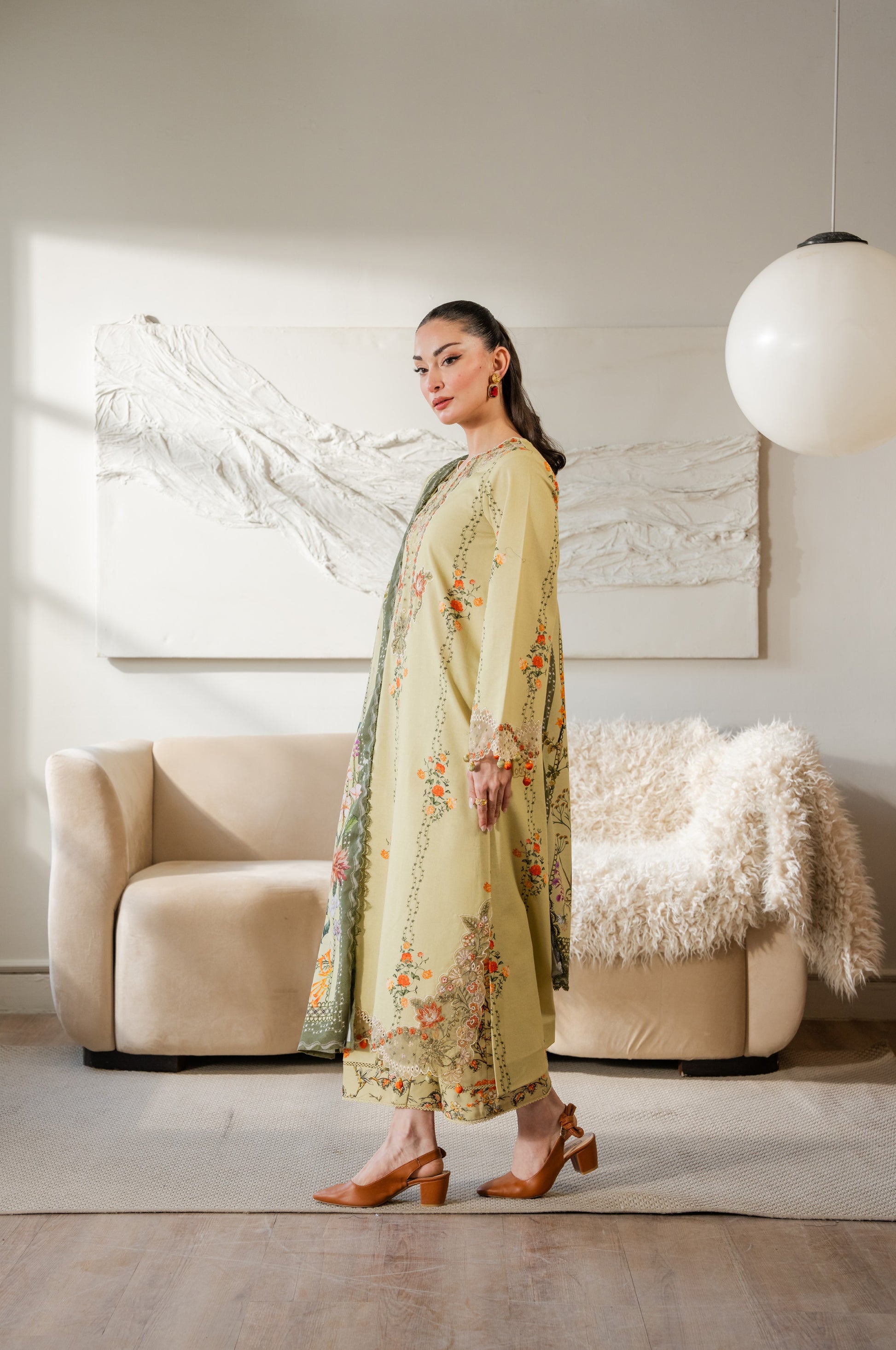 Bright printed dupatta paired with khaddar embroidered shirt and dyed trousers.