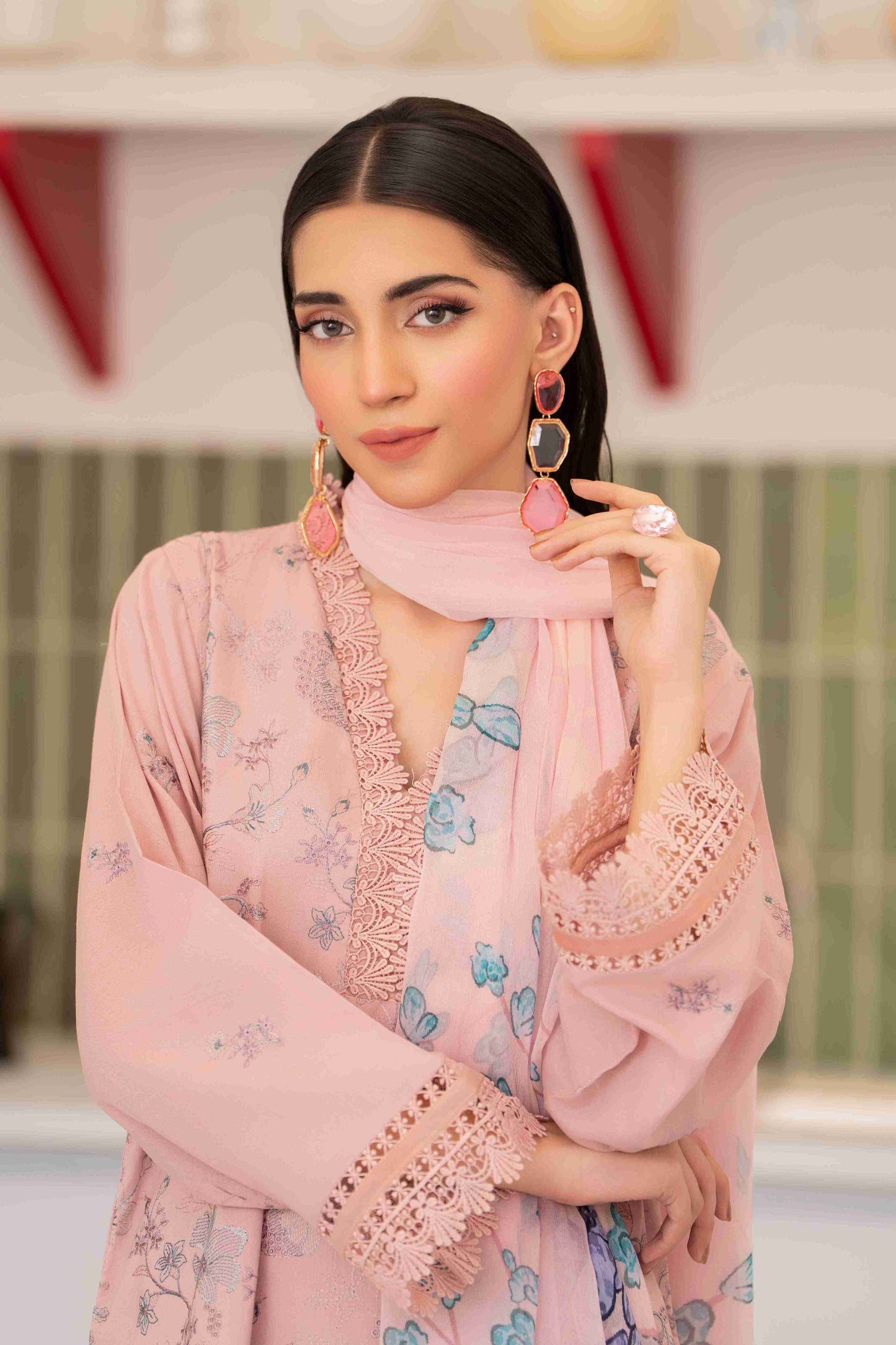 Stylish three-piece outfit featuring embroidered lawn shirt, chiffon dupatta, and cotton trousers
